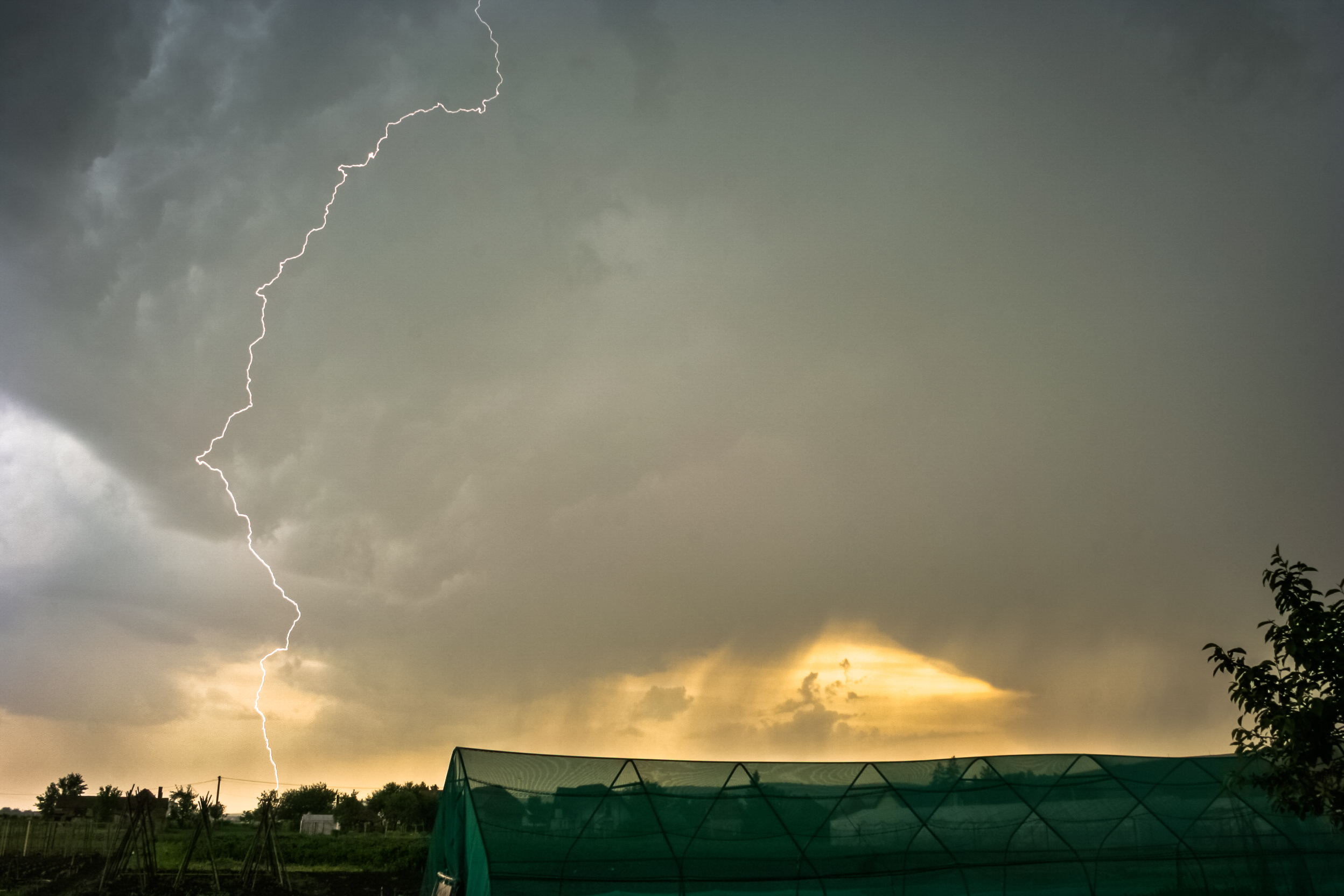 Dangerously close day time lightning bolt strikes from a severe thunderstorm