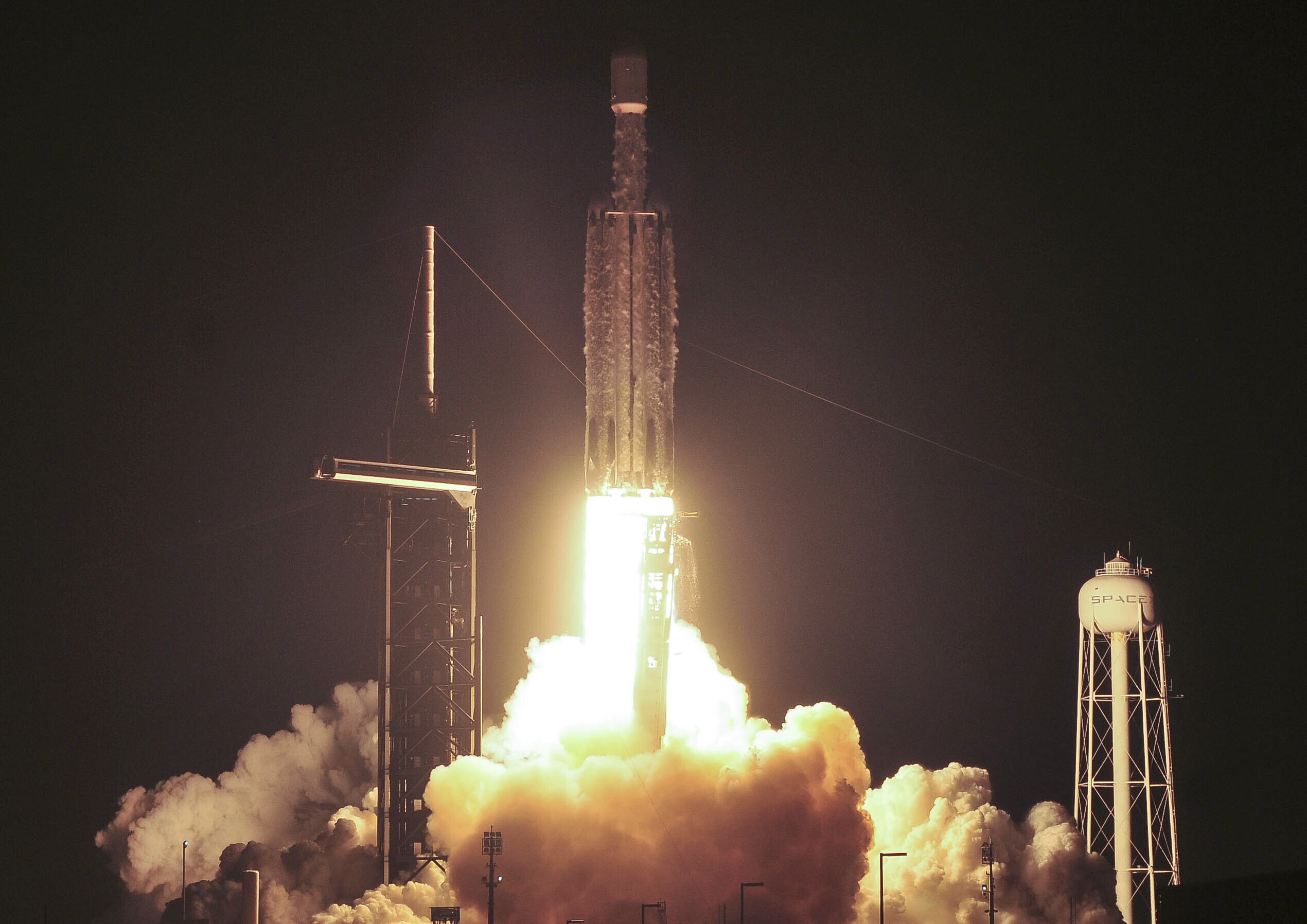 A SpaceX Falcon Heavy rocket lifts off from Kennedy Space Center at Cape Canaveral, Fla., Thursday, Dec. 28, 2023. The rocket was carrying the U.S. military's X-37B secret space plane. (Craig Bailey/Florida Today via AP)