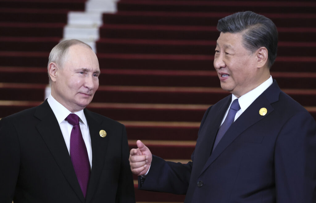 Russian President Vladimir Putin, left, and Chinese President Xi Jinping talk during their meeting on the sidelines of the Belt and Road Forum in Beijing, China, on Tuesday, Oct. 17, 2023. (Sergey Savostyanov, Sputnik, Kremlin Pool Photo via AP)