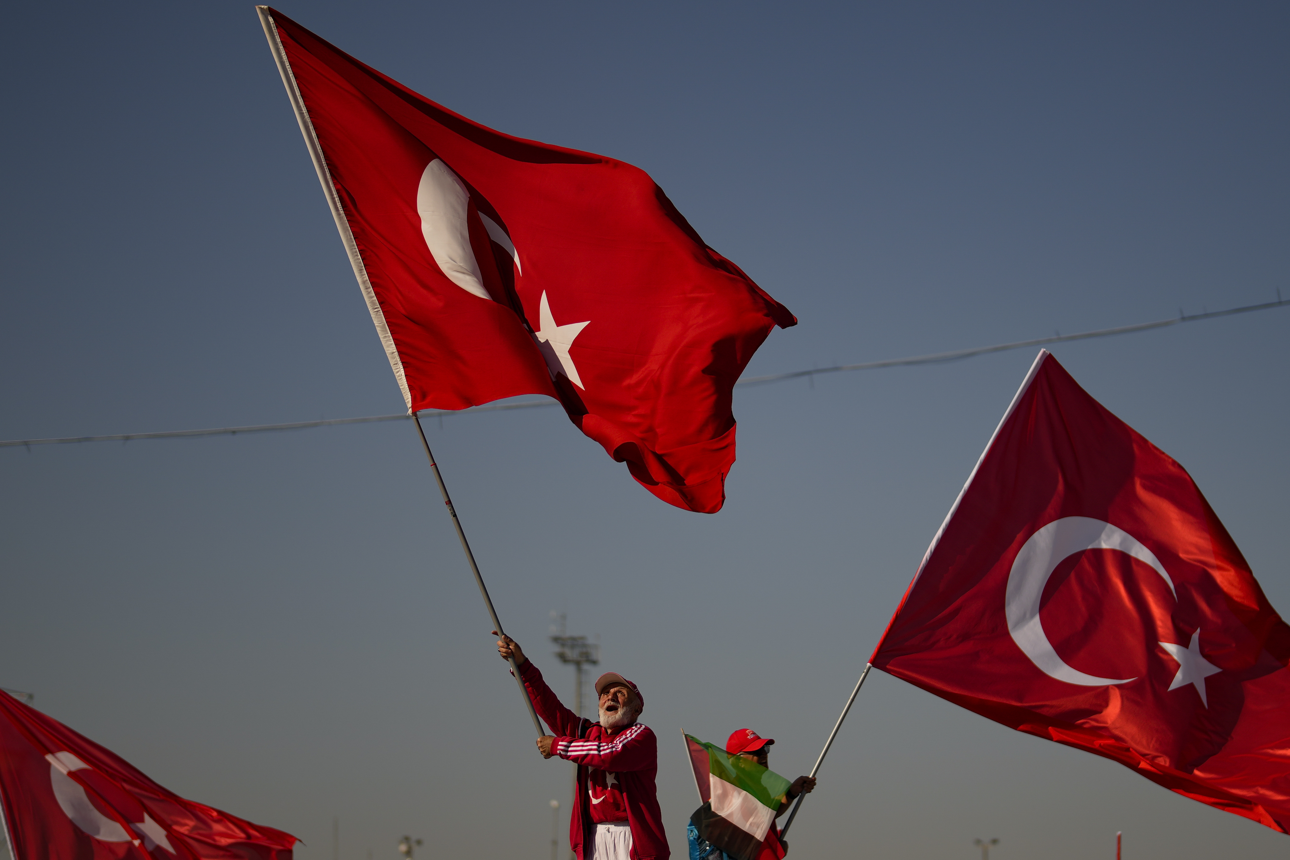 Protesters wave Turkish and Palestinian flags while attending a rally to show their solidarity with the Palestinians, in Istanbul, Turkey, Saturday, Oct. 28, 2023. (AP Photo/Emrah Gurel)