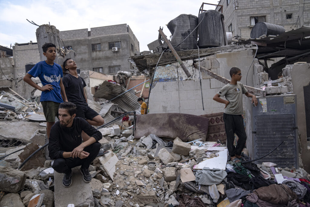 Palestinians inspect the rubble of a house after it was struck by an Israeli airstrike in Khan Younis, southern Gaza Strip, Sunday, Oct. 29, 2023. (AP Photo/Fatima Shbair)