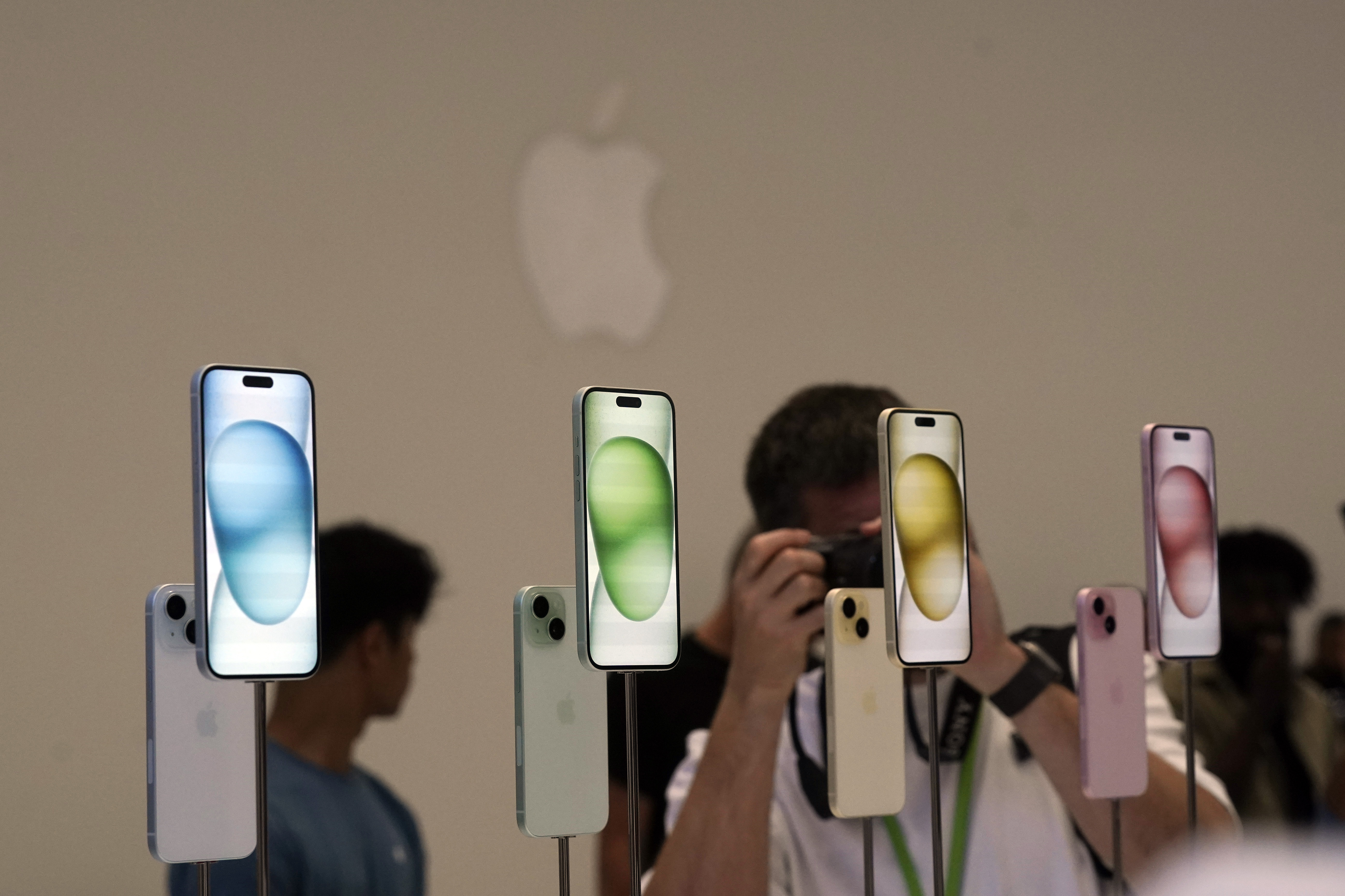 iPhone 15 and 15 Plus models are displayed during an announcement of new products on the Apple campus, Tuesday, Sept. 12, 2023, in Cupertino, Calif. (AP Photo/Jeff Chiu)