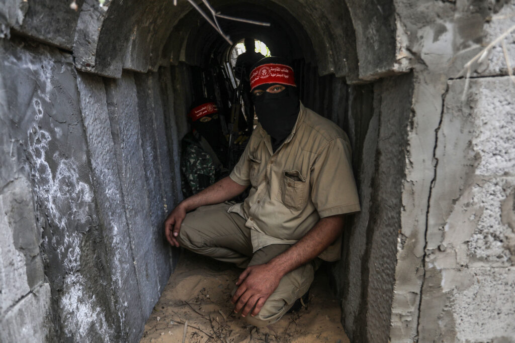 Fighters from the Democratic Front for the Liberation of Palestine (DFLP) walk in a tunnel  in the southern Gaza Strip during preparation and preparation after the recent escalation, on May 19, 2023.
