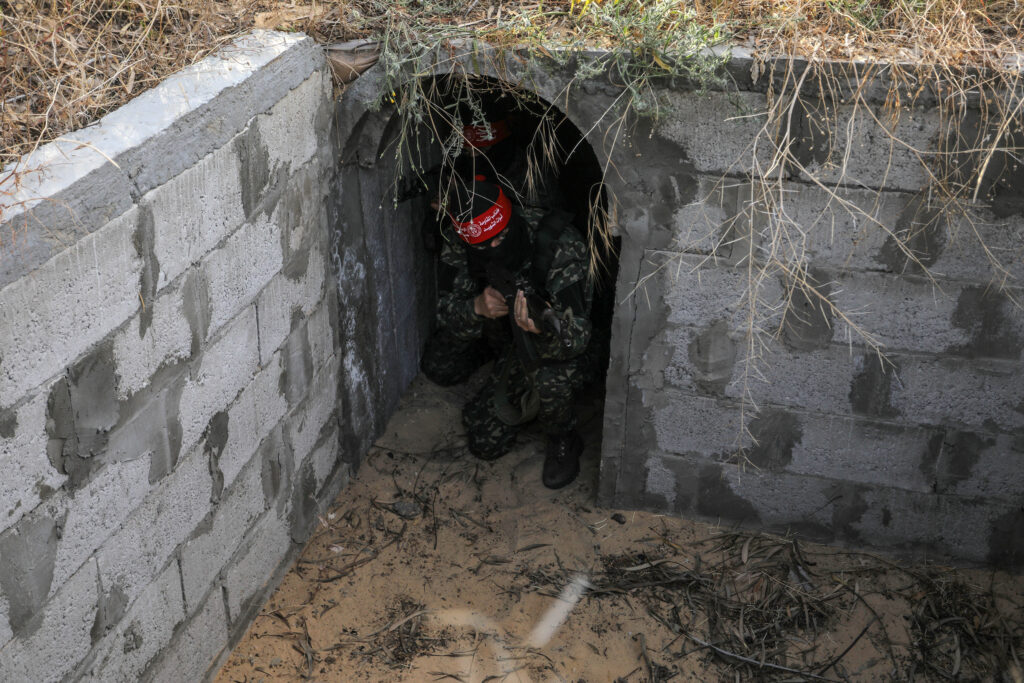 Fighters from the Democratic Front for the Liberation of Palestine (DFLP) walk in a tunnel  in the southern Gaza Strip during preparation and preparation after the recent escalation, on May 19, 2023.