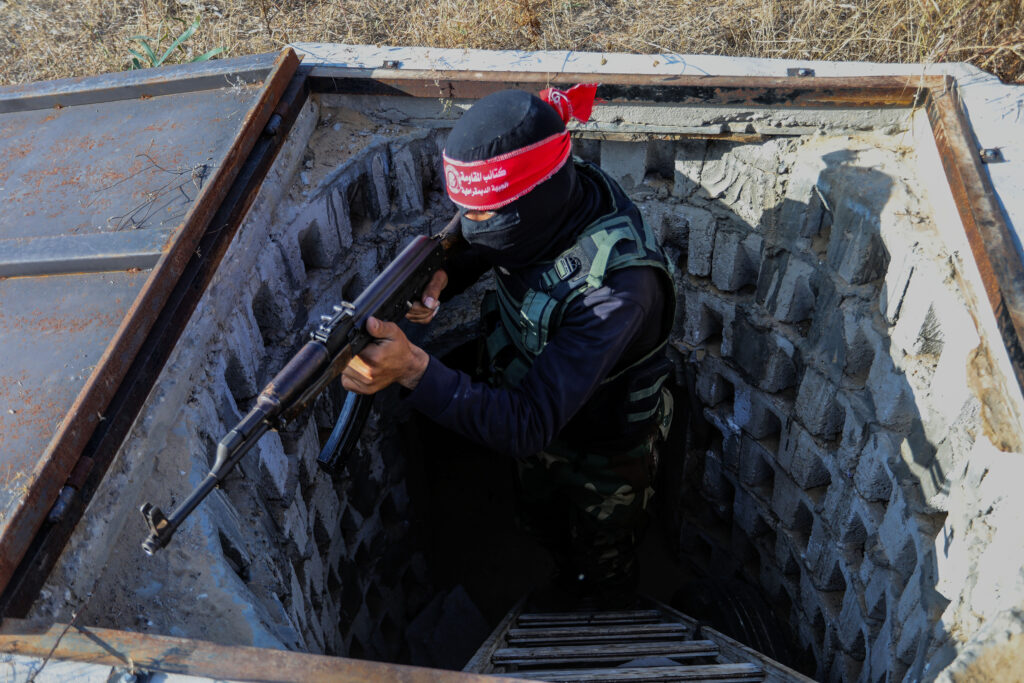 Fighters from the Democratic Front for the Liberation of Palestine (DFLP) walk in a tunnel  in the southern Gaza Strip during preparation and preparation after the recent escalation, on May 19, 2023.