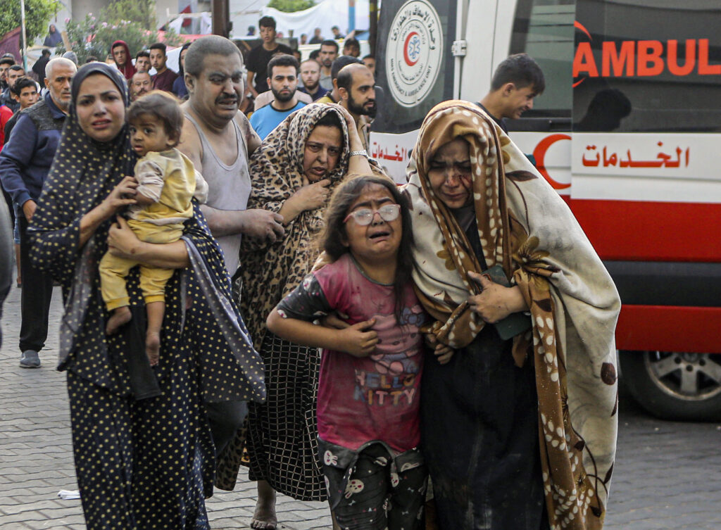 Injured Palestinians arrive at al-Shifa Hospital following Israeli airstrikes on Gaza City, central Gaza Strip, Monday, Oct. 16, 2023. (AP Photo/Abed Khaled)