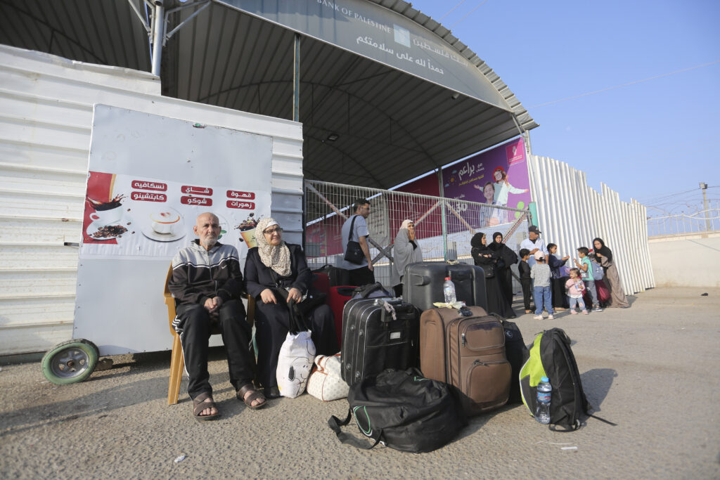 Palestinains wait at The border crossing bwteen Gaza Strip and Egypt in Rafah, Wednesday, Nov. 1, 2023. (AP Photo/Hatem Ali)