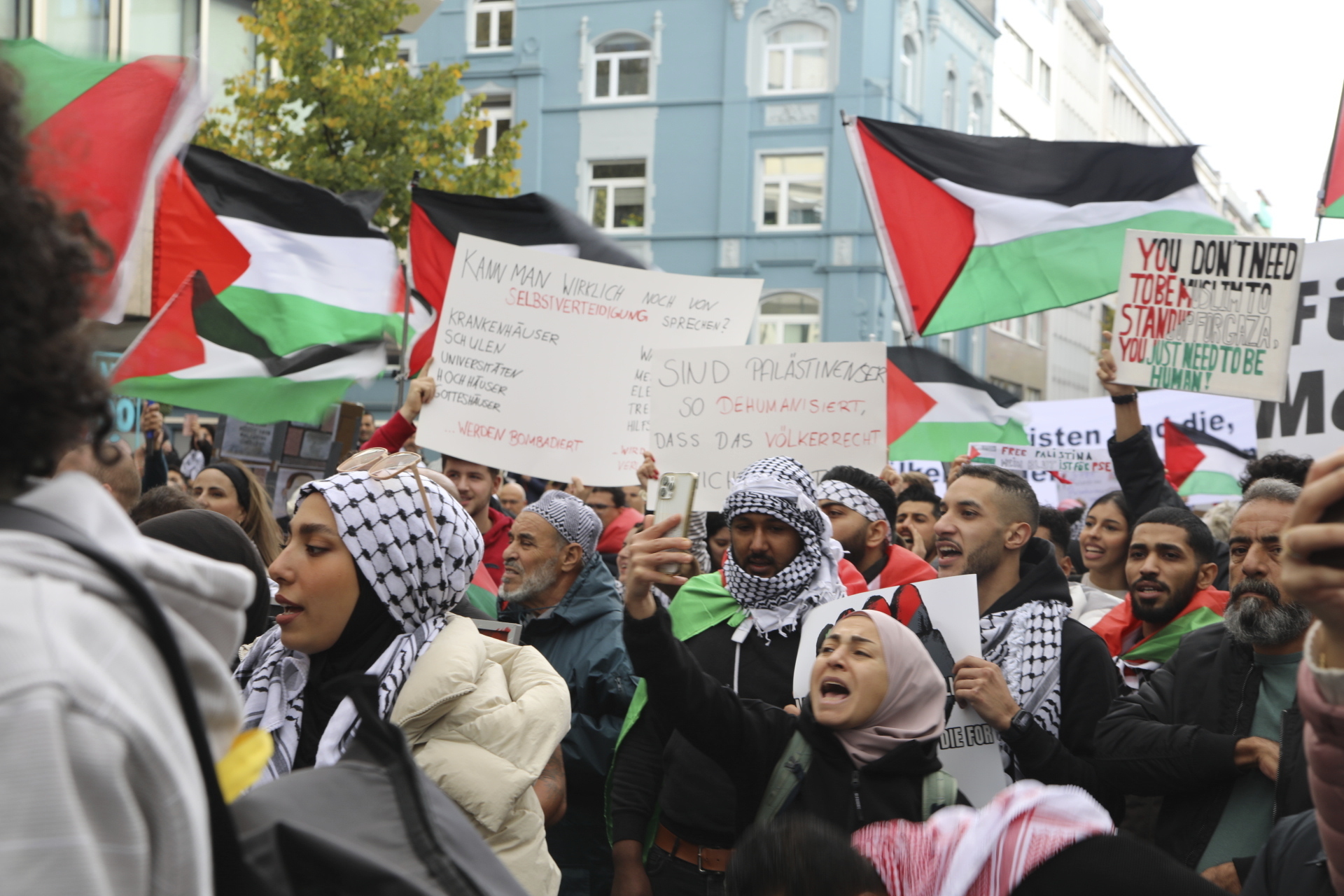 People take part in a pro-Palestinian rally, in Duesseldorf, Germany, Saturday, Oct. 21, 2023. (Sascha Thelen/dpa via AP)