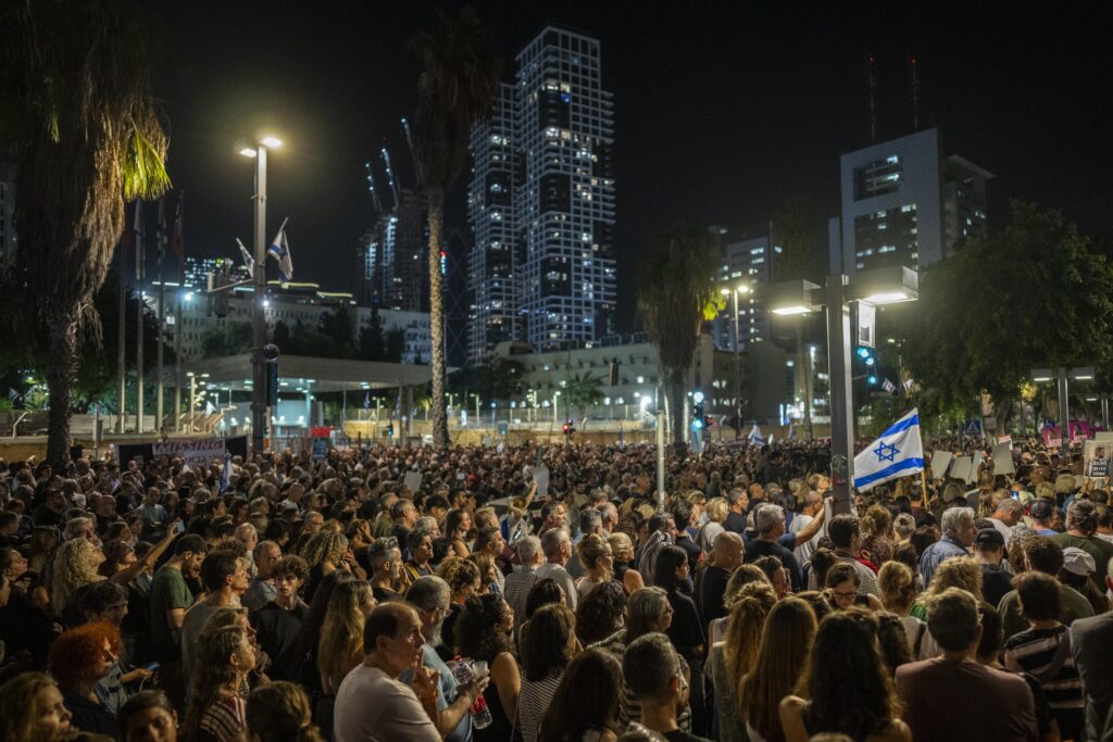 People demonstrate alongside relatives of people kidnapped during the Oct. 7 Hamas cross-border attack in Israel, during a protest calling for the return of the hostages, in Tel Aviv, Israel, Saturday, Nov. 4, 2023. (AP Photo/Bernat Armangue)