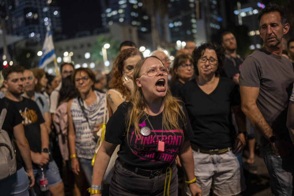 A woman shouts slogans calling for the return of the hostages kidnapped during the Oct. 7 Hamas cross-border attack in Israel, during a demonstration in Tel Aviv, Saturday, Nov. 4, 2023. (AP Photo/Bernat Armangue)