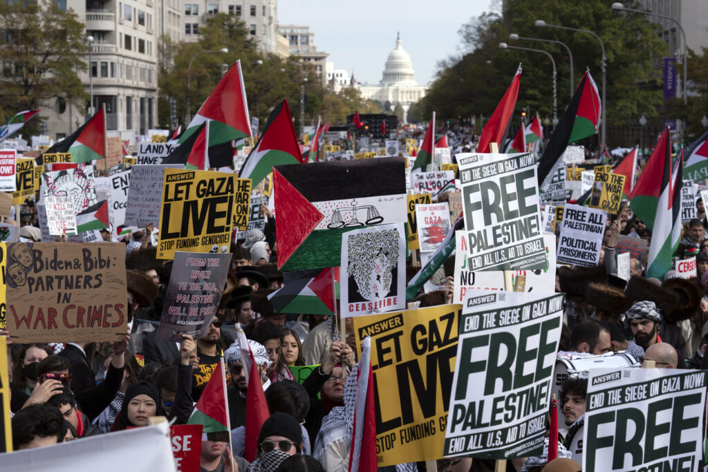 With the U.S. Capitol n the background thousands of anti-war activists rally during a pro-Palestinian demonstration asking to cease fire in Gaza, at Freedom Plaza in Washington, Saturday, Nov. 4, 2023. (AP Photo/Jose Luis Magana)