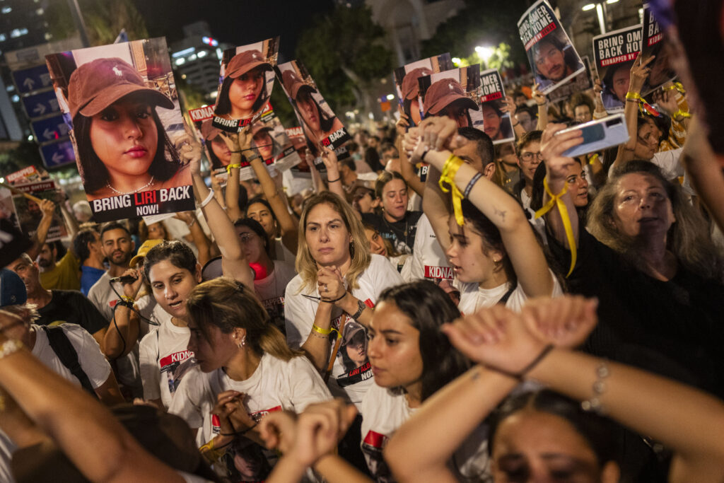 Relatives and friends of people kidnapped during the Oct. 7 Hamas cross-border attack in Israel, demonstrate during a protest calling for the return of the hostages, in Tel Aviv, Israel, Saturday, Nov. 4, 2023. (AP Photo/Bernat Armangue)
