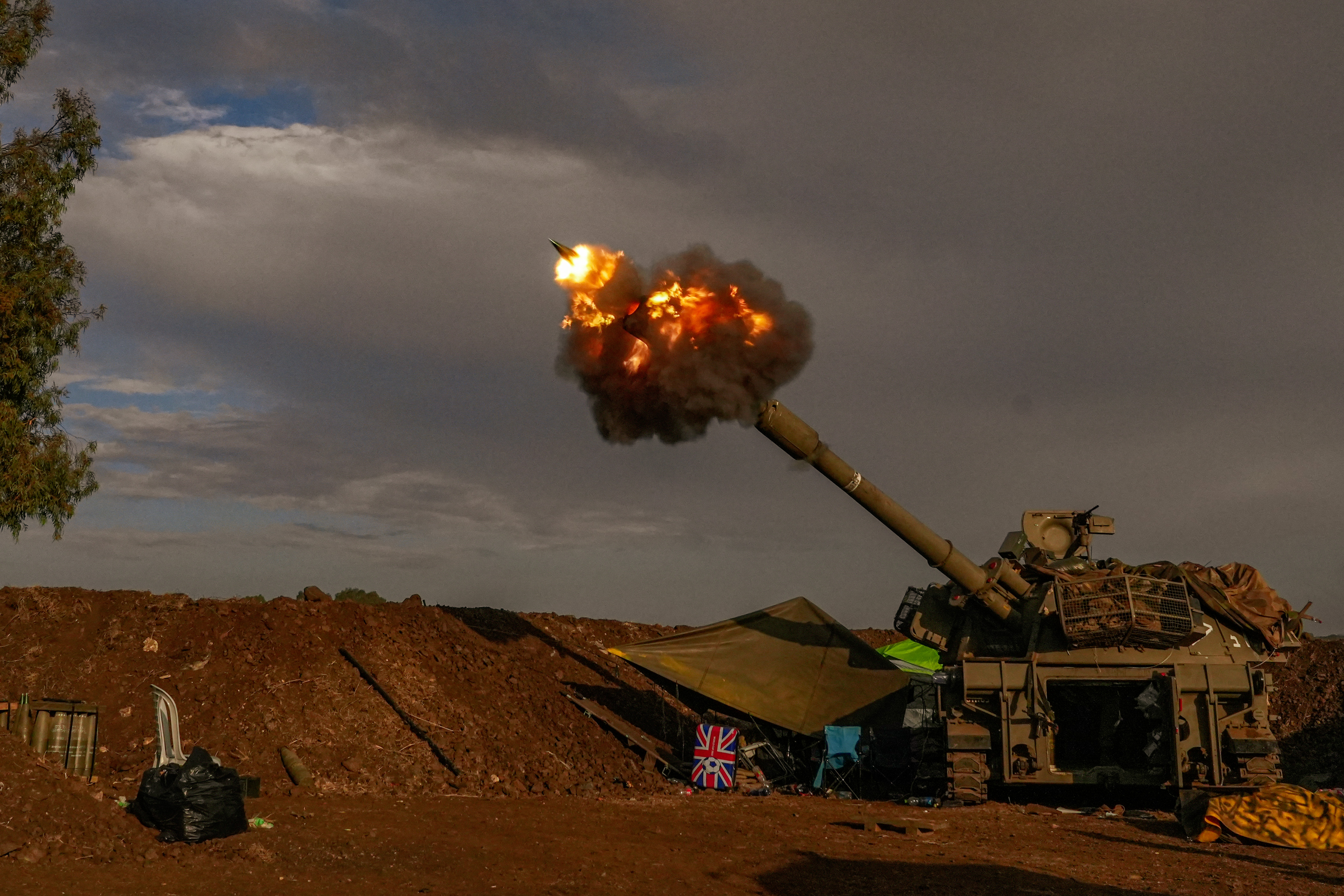 An Israeli artillery unit fires during a military drill in the annexed Golan Heights