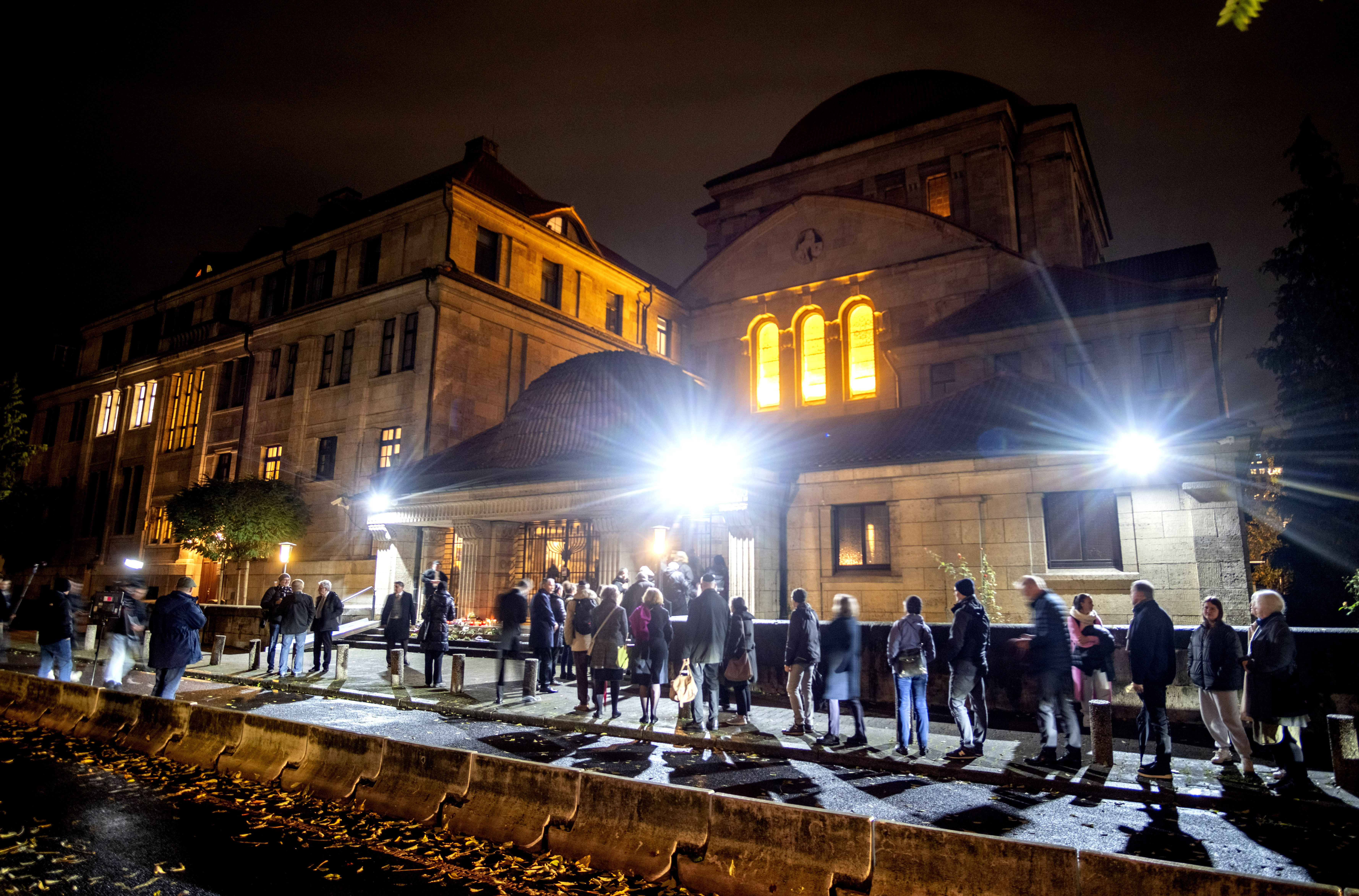 People queue in front of the synagogue in Frankfurt, Germany, Thursday, Nov. 9, 2023 where a memorial ceremony on the 85th anniversary of the Nazis' anti-Jewish pogrom in 1938 takes place. (AP Photo/Michael Probst)