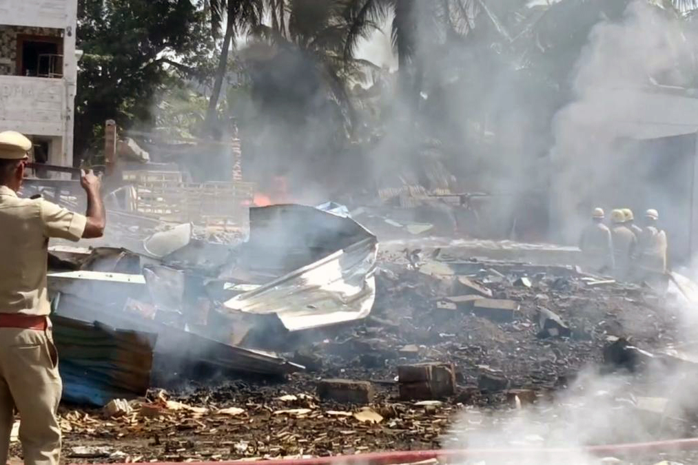 A policeman gives instructions at the site of an explosion in a firecrackers' factory in Krishnagiri district in Tamil Nadu, India, Saturday, 29 July, 2023. Police say that the explosion killed eight people and wounded several others. (AP Photo/STR)