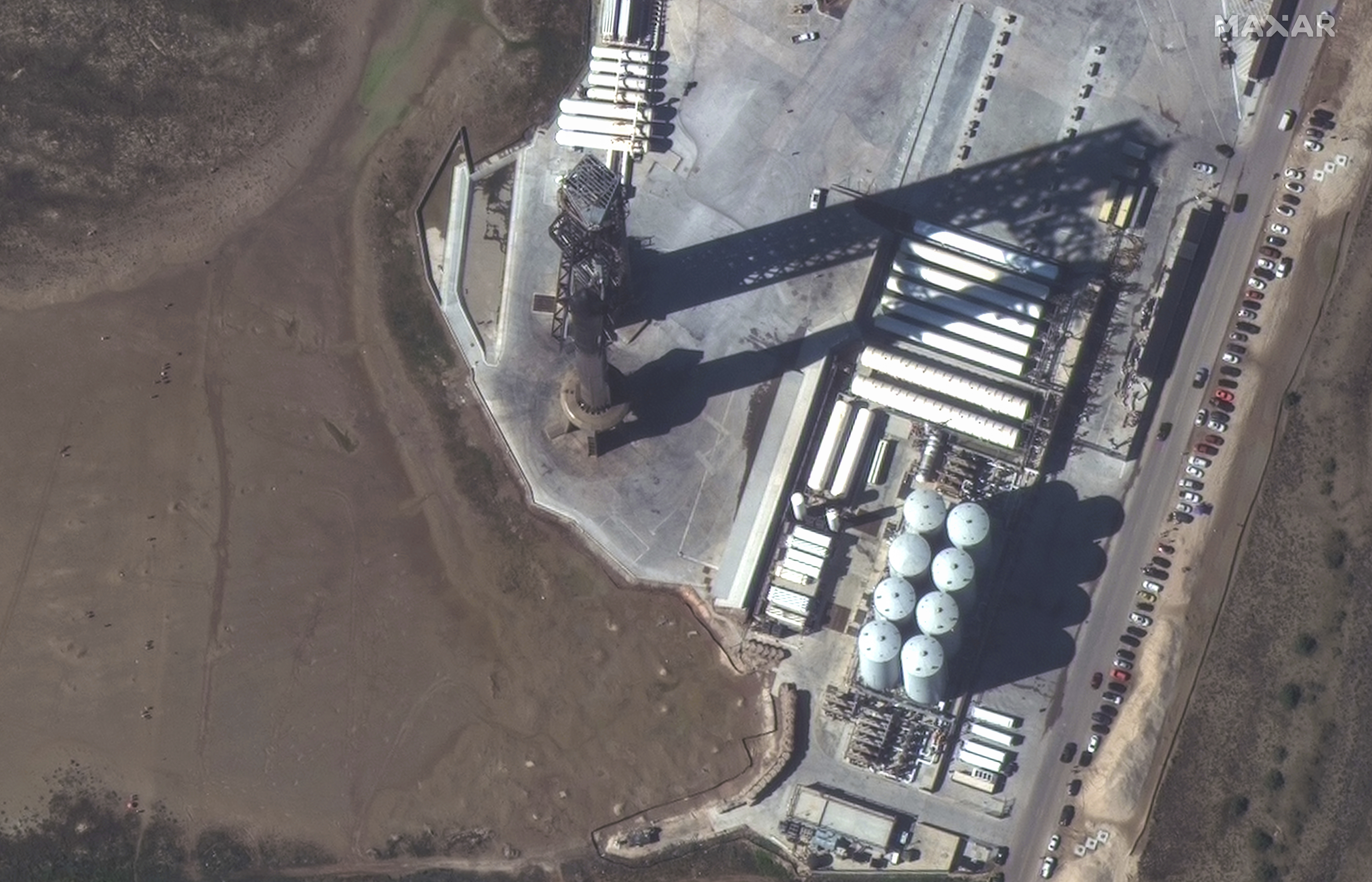 This image provided by Maxar Technologies shows a closeup view of SpaceX Starship stacked atop of the Super Heavy booster at the launch site, Friday, Nov. 17, 2023, in Boca Chica, Texas. (Satellite image ©2023 Maxar Technologies via AP)