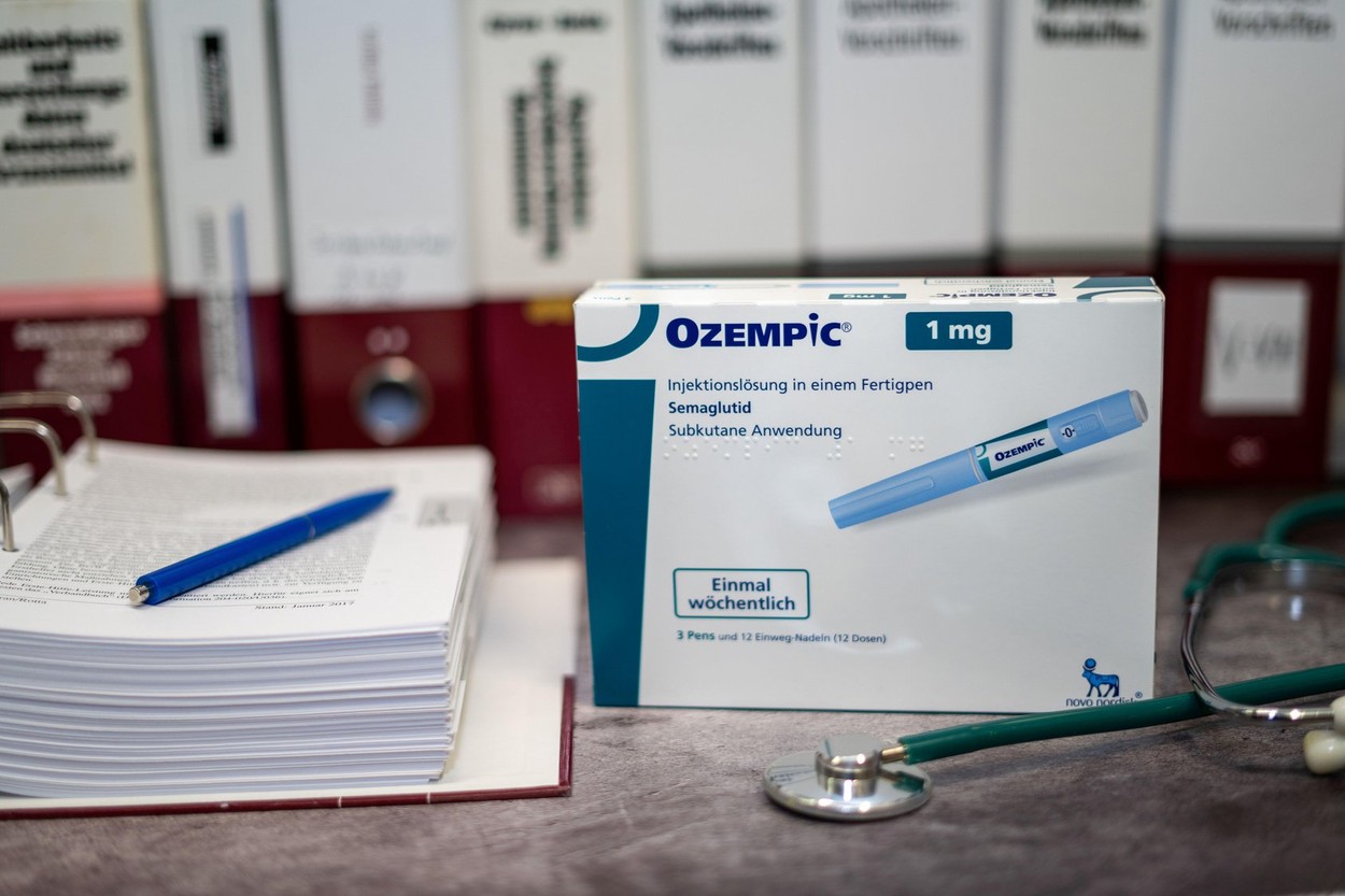 A Drug box of  Ozempic containing Semaglutide for treatment of type 2 diabetes and long-term weight management on a table and in the background differ