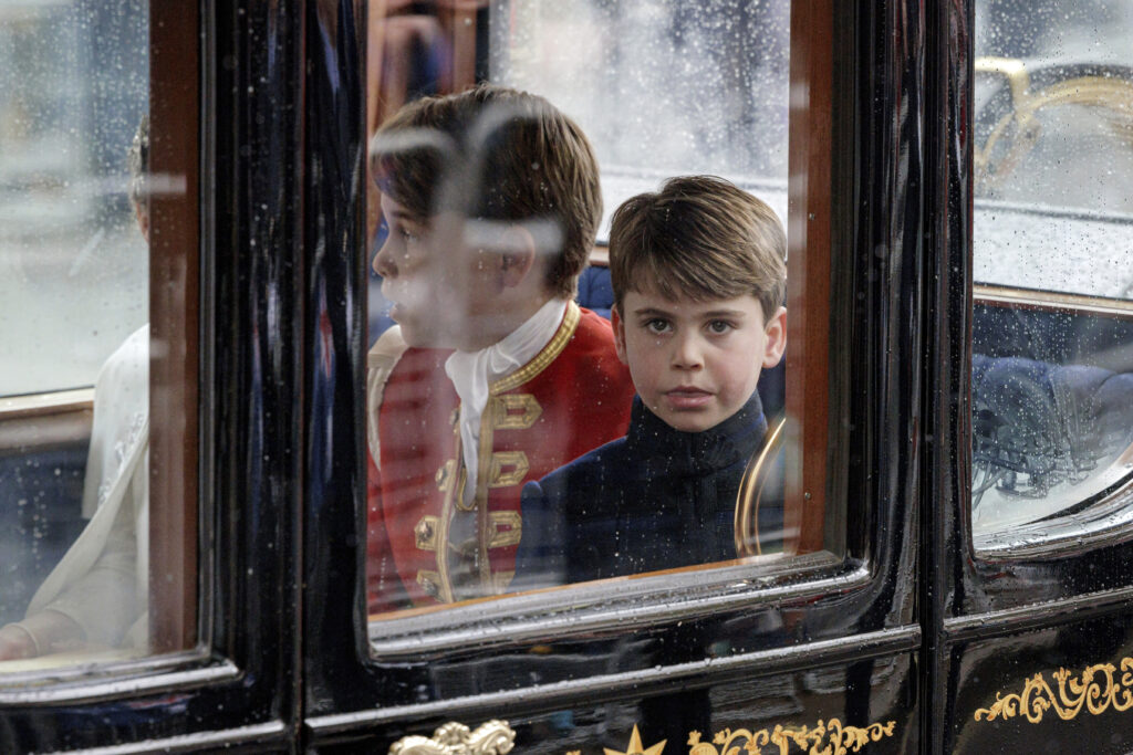 Prince Louis and Page of Honour Prince George depart the Coronation service of King Charles III and Queen Camilla, London, Saturday, May 6, 2023. (Rob Pinney/Pool Photo via AP)