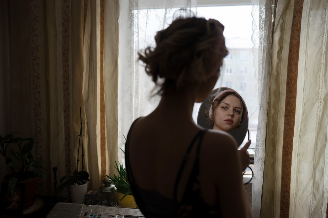 Woman looking in mirror