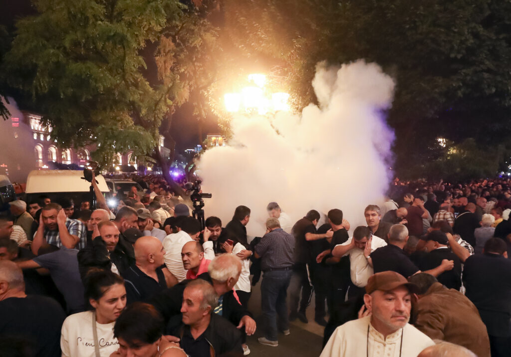 Demonstrators clash with police at the Armenia government building to protest against Prime Minister Nikol Pashinyan in Yerevan, Armenia, Tuesday, Sept. 19, 2023. (Vahram Baghdasaryan/Photolure via AP)