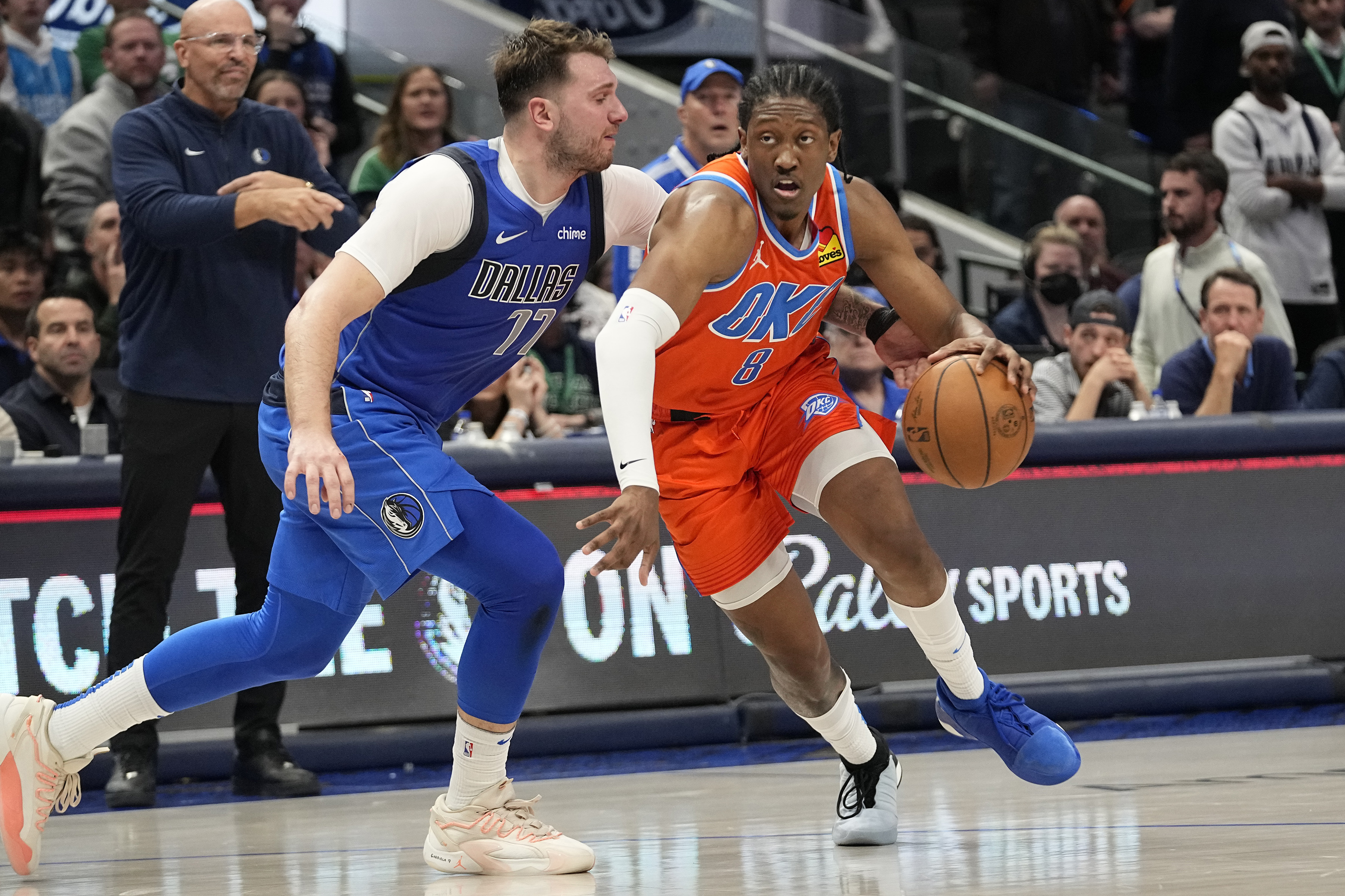 Oklahoma City Thunder forward Jalen Williams (8) dribbles against Dallas Mavericks guard Luka Doncic (77) during the second half of an NBA basketball game in Dallas, Saturday, Dec. 2, 2023. (AP Photo/LM Otero)