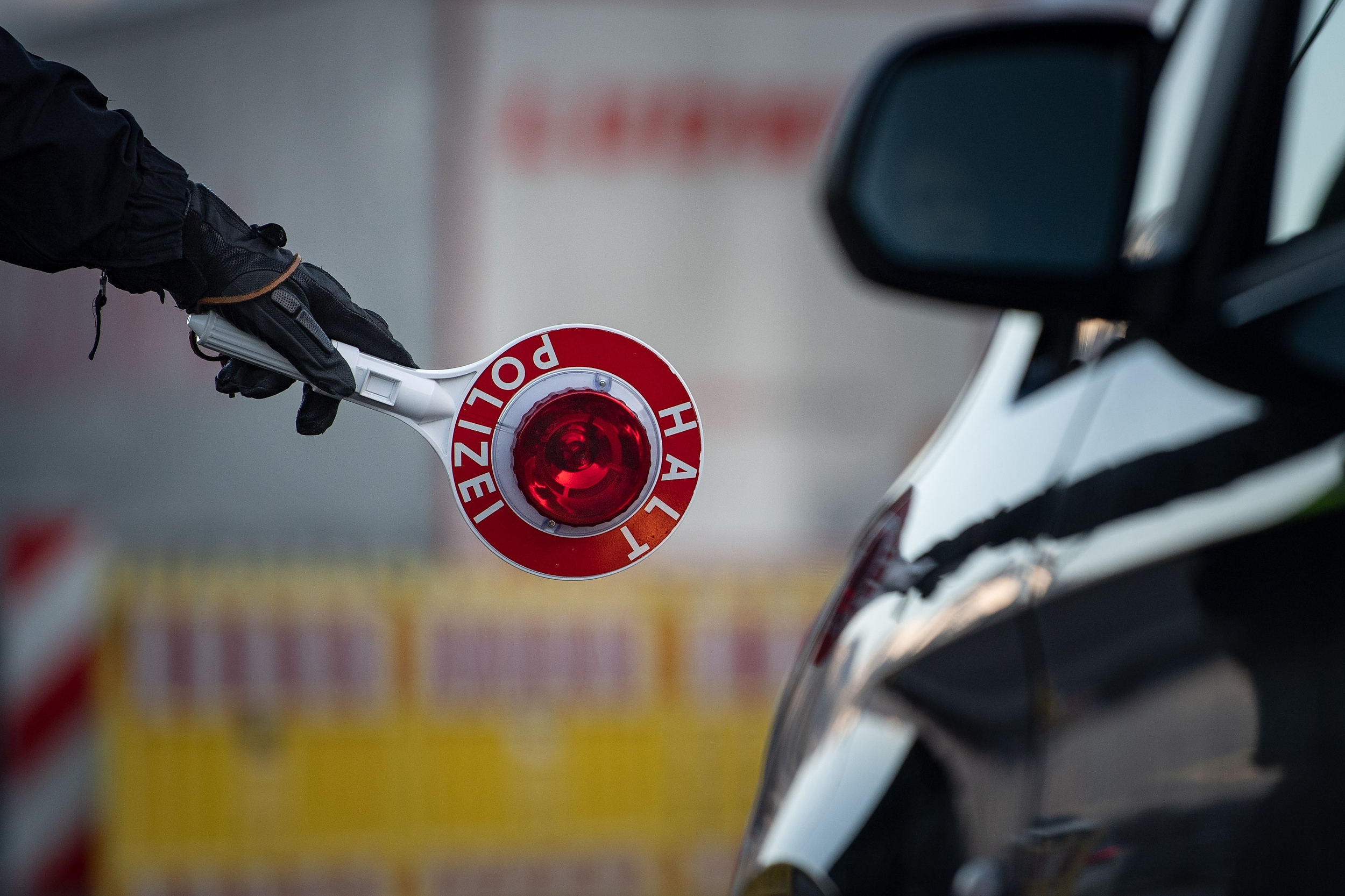 epa08043522 A police officer stops a vehicle at a border checkpoint on the Autobahn A93 in Kiefersfelden, Germany, 04 December 2019. The regular border controls, reinstated in 2015, aim to fight illegal migration.  EPA-EFE/PHILIPP GUELLAND