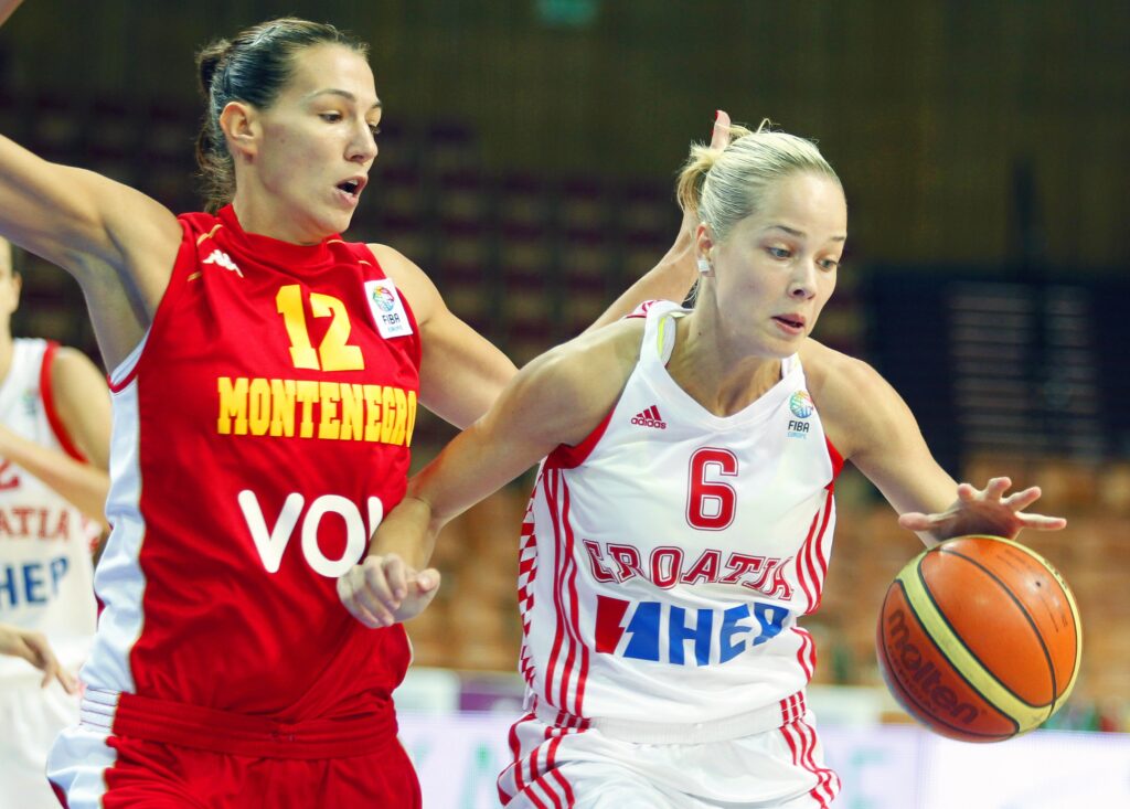 epa02789663 Antonija Misura (R) of Croatia vies for the ball with Iva Perovanovic (L) of Montenegro during their European Women Basketball Championship group F  match in Katowice, Poland, 22 June 2011.