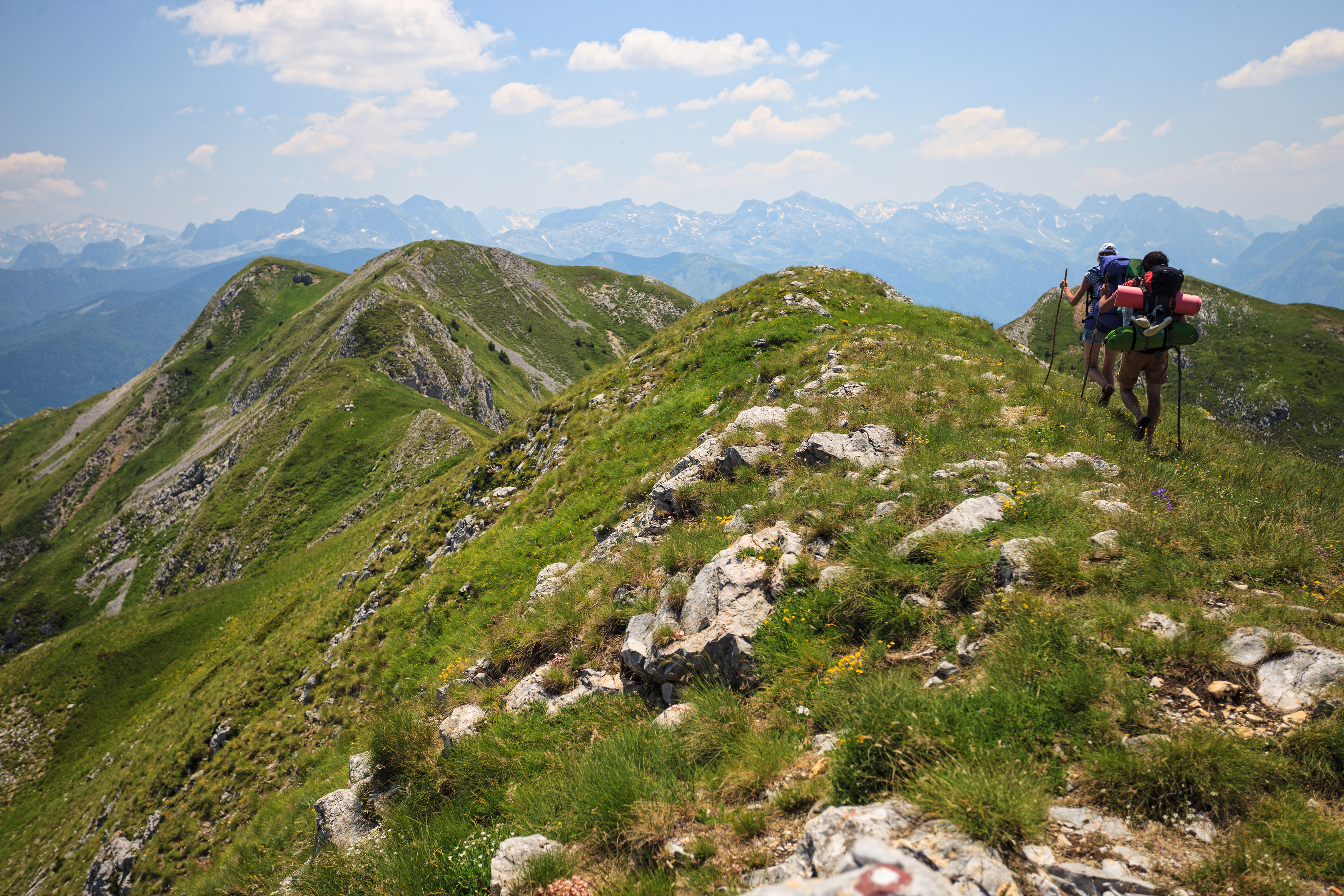 Beautiful,Couple,With,Backpacks,Traveling,In,Visitor,Mountains,,Montenegro