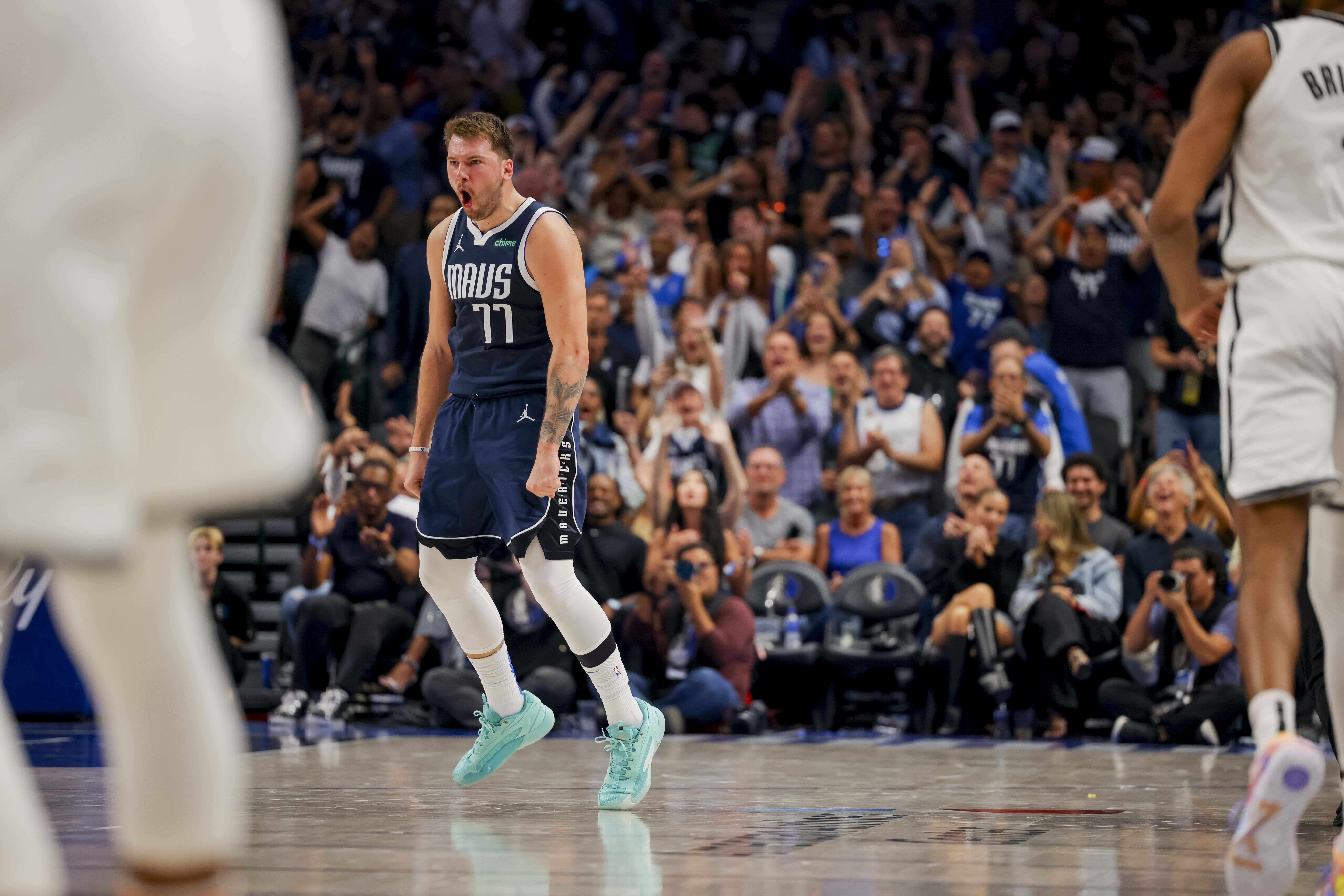 Dallas Mavericks guard Luka Doncic (77) celebrates his 3-pointer against the Brooklyn Nets during the second half of an NBA basketball game Friday, Oct. 27, 2023, in Dallas. (AP Photo/Gareth Patterson)