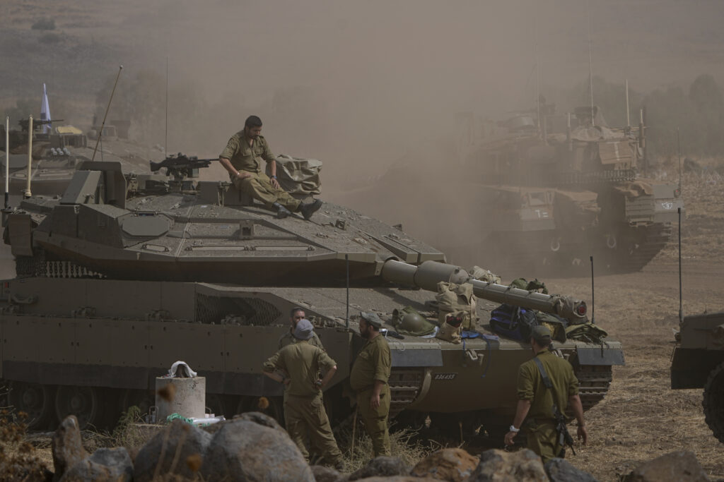 Israeli tanks are stationed near the border with Lebanon Wednesday, Oct. 11, 2023. (AP Photo/Ariel Schalit)