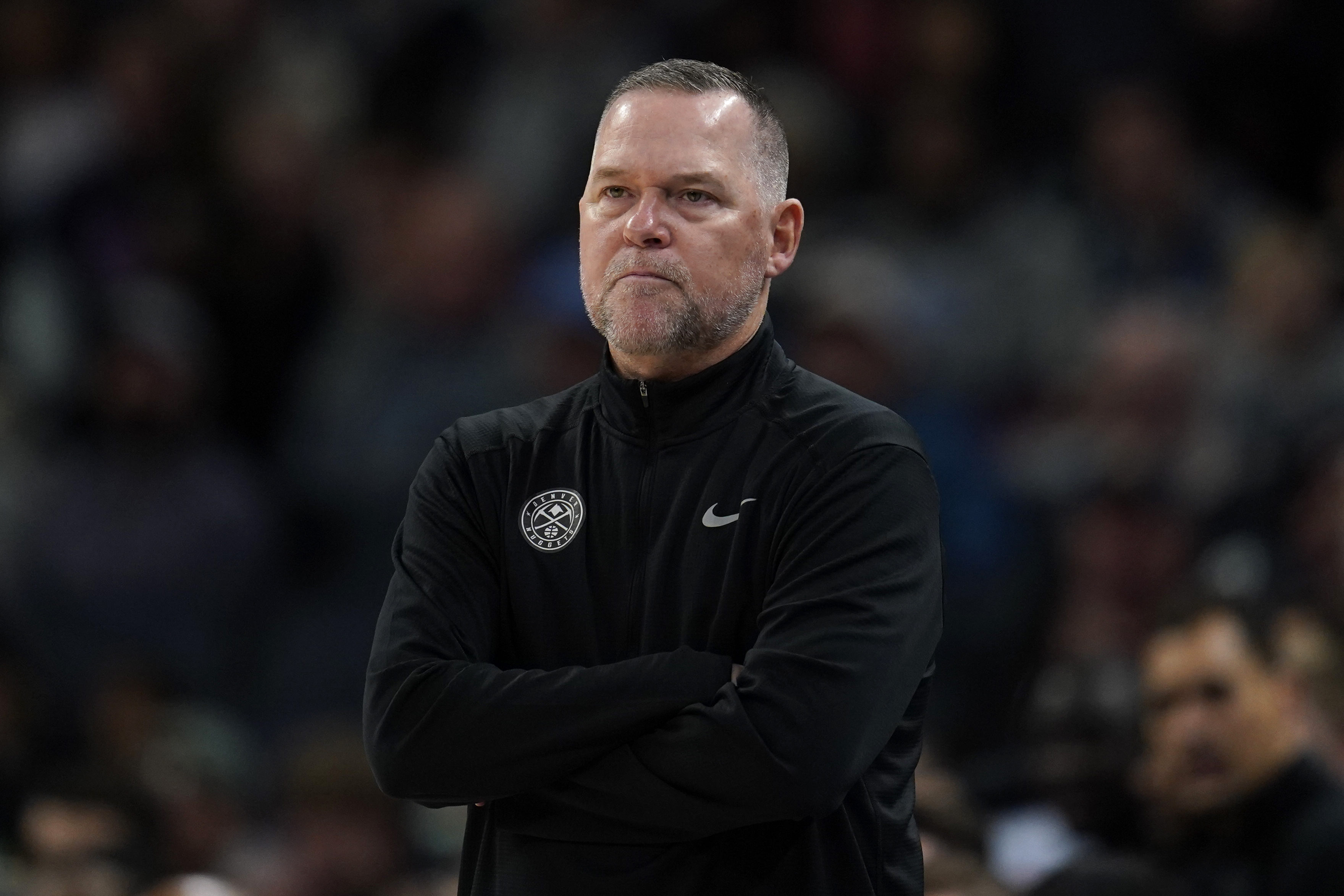 Denver Nuggets head coach Michael Malone watches his team during the first half of an NBA basketball game against the Minnesota Timberwolves, Sunday, Feb. 5, 2023, in Minneapolis. (AP Photo/Abbie Parr)
