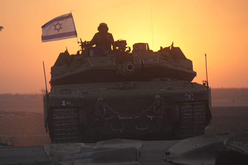 Israeli tanks head towards the Gaza Strip border in southern Israel on Thursday, Oct.12, 2023. (AP Photo/Ohad Zwigenberg)