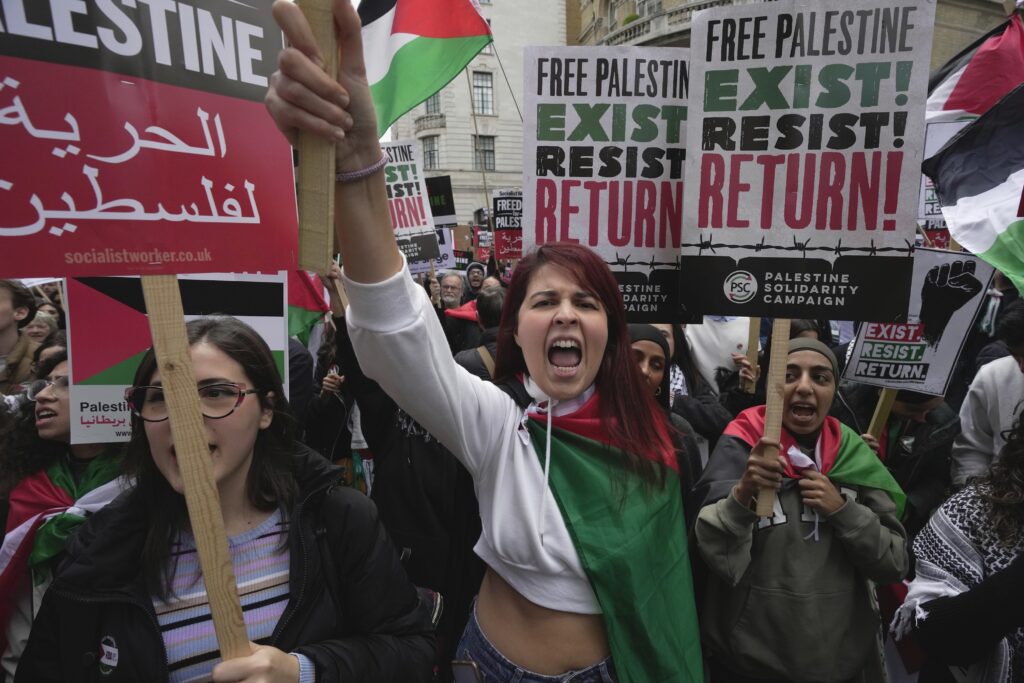 Protesters attend a pro Palestinian demonstration in London, Saturday, Oct. 14, 2023. Palestine Solidarity Campaign hosts march in support of Palestinians caught up in the war between Israel and Hamas. (AP Photo/Kin Cheung)