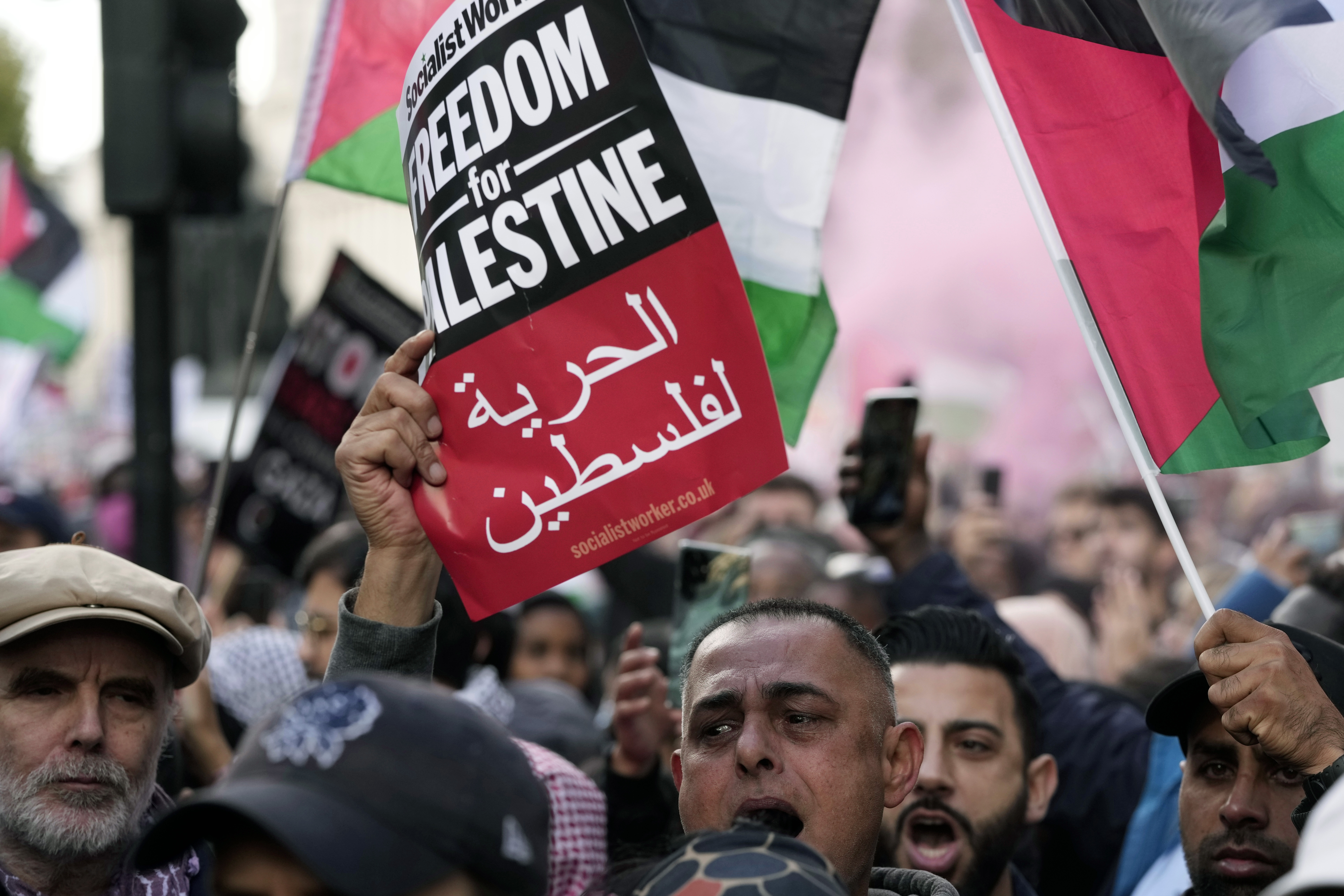 Protesters attend a pro Palestinian demonstration in London, Saturday, Oct. 14, 2023. Palestine Solidarity Campaign hosts march in support of Palestinians caught up in the war between Israel and Hamas. (AP Photo/Kin Cheung)