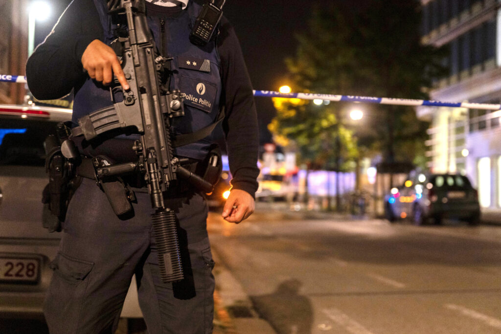 Police cordon off an area where a shooting took place in the center of Brussels, Monday, Oct. 16, 2023. Belgian police say that two people are dead in central Brussels after several shots were fired. (AP Photo/Nicolas Landemard)