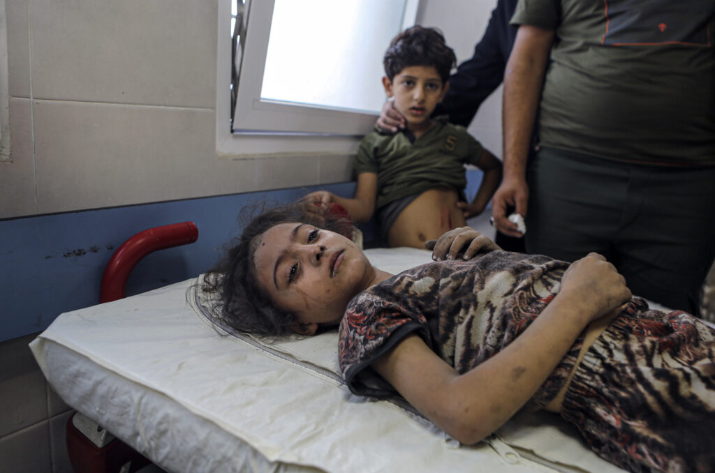 A wounded Palestinian girl receives treatment at al-Shifa hospital, following Israeli airstrikes on Gaza City, central Gaza Strip, Tuesday, Oct. 17, 2023. (AP Photo/Abed Khaled)