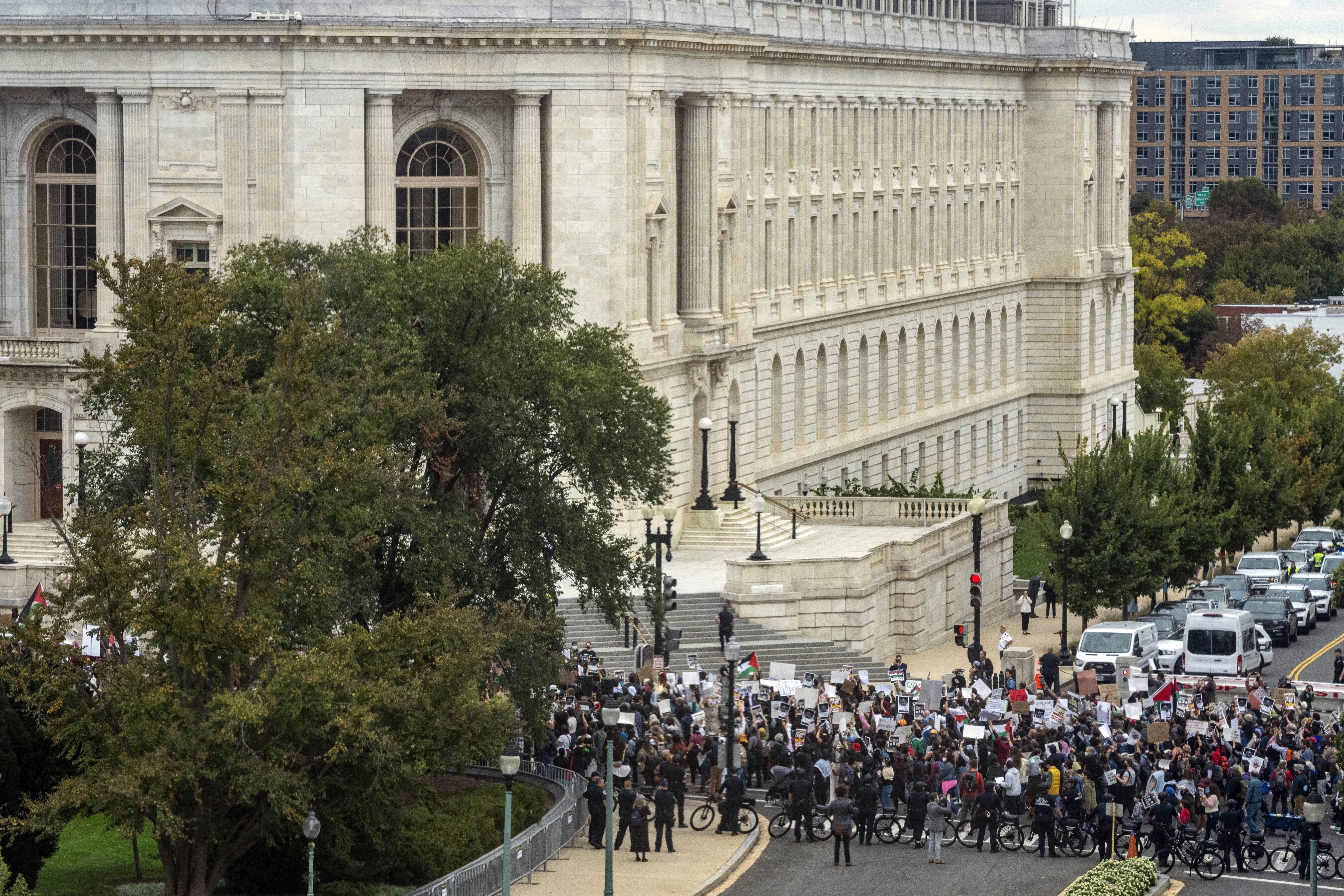 People protest near the Canon House Office Building as seen from the U.S. Capitol in Washington, Wednesday, Oct. 18, 2023. (AP Photo/Alex Brandon)