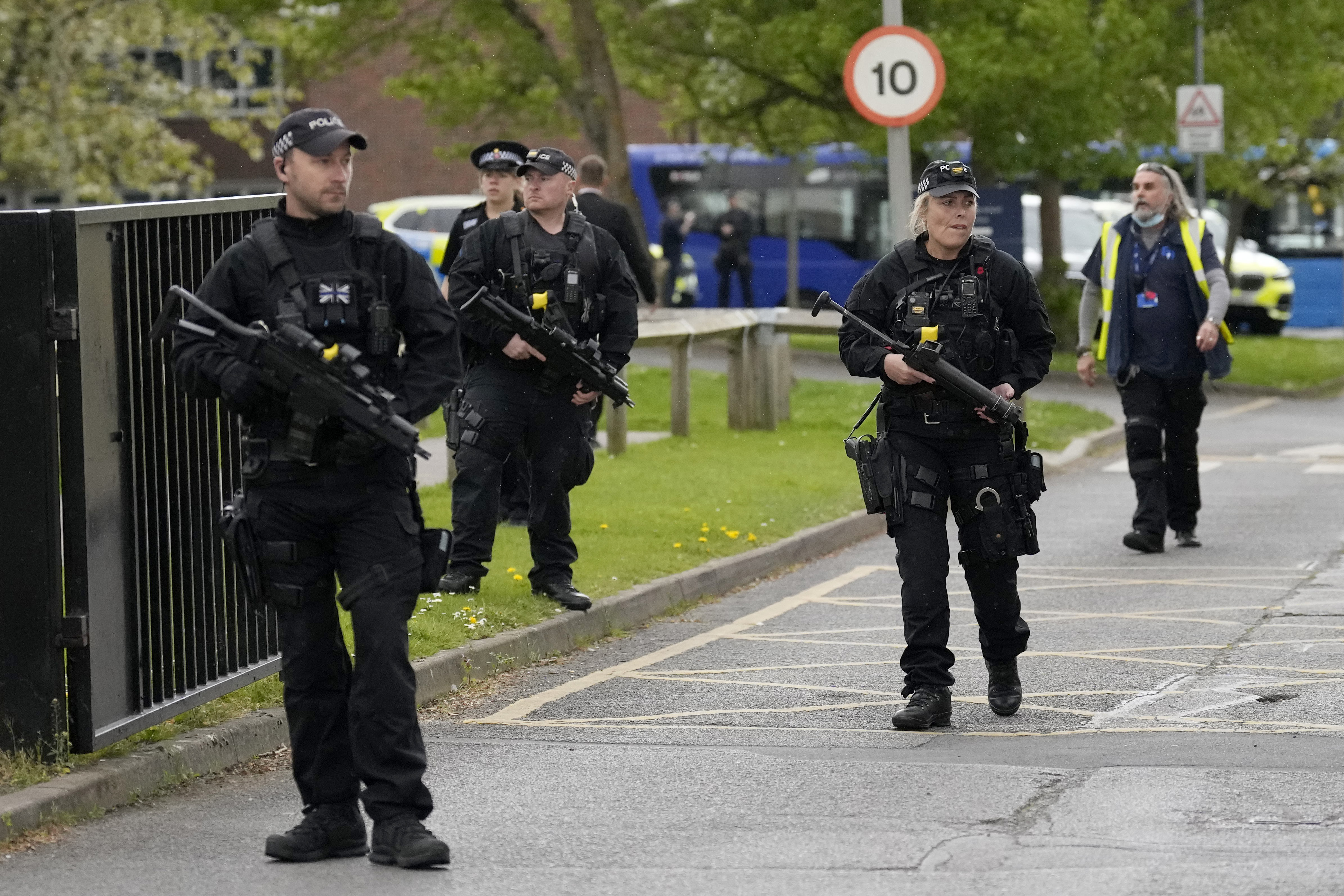 Armed police at Esher Church of England High School following reports of a "concern for safety" in Esher, Surrey, England. Monday, April 25, 2022. (AP Photo/Matt Dunham)