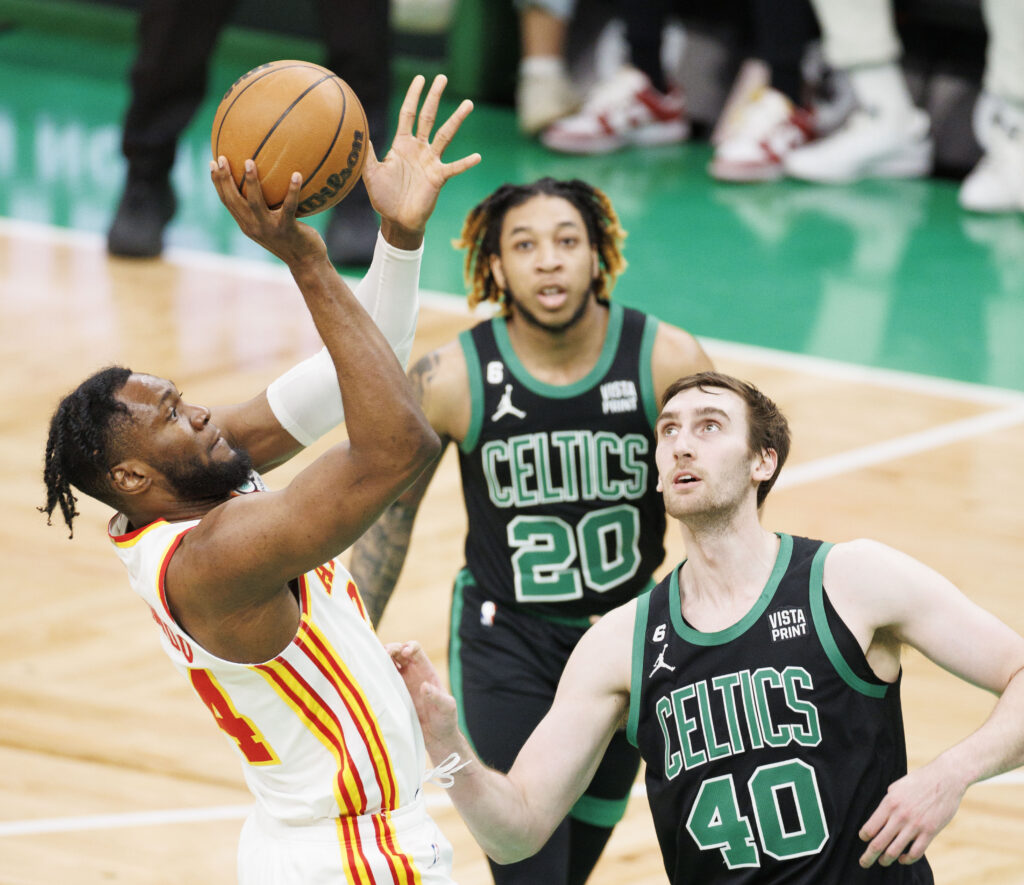 epa10566702 Atlanta Hawks forward Bruno Fernando (L) shoots over Boston Celtics center Luke Kornet (R) during the NBA game at the TD Garden in Boston, Massachusetts, USA, 09 April 2023.  EPA-EFE/CJ GUNTHER SHUTTERSTOCK OUT SHUTTERSTOCK OUT