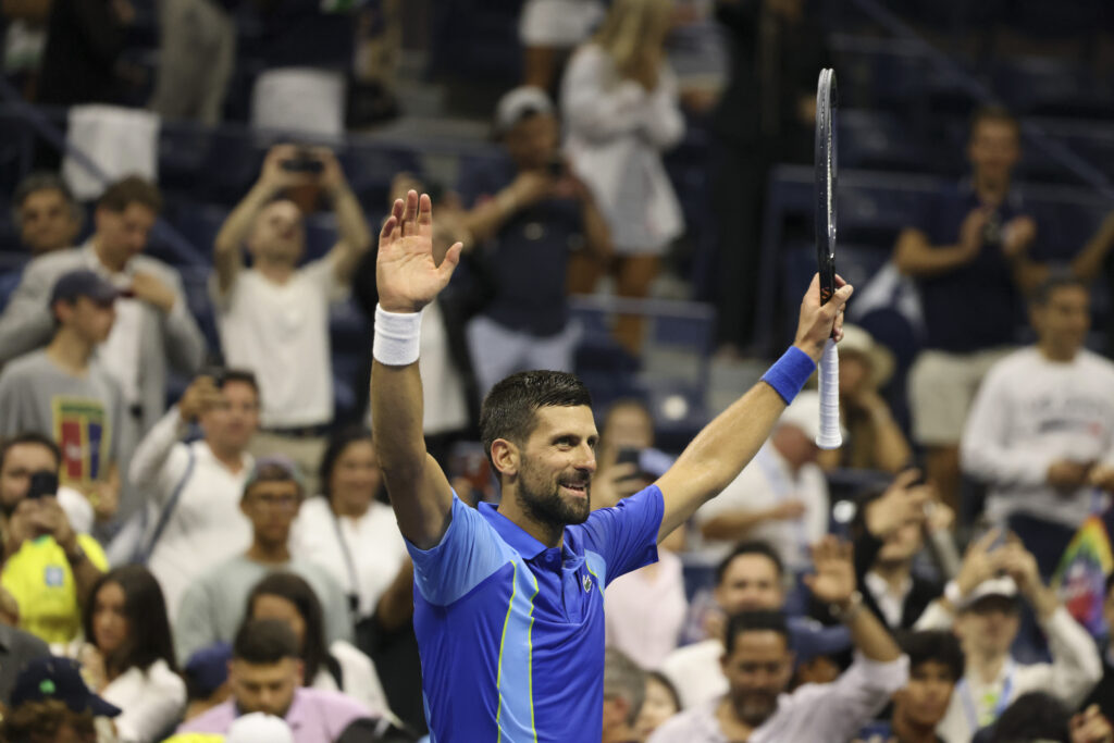 Novak Djokovic, of Serbia, celebrates winning his match against Alexandre Muller, of France, during the first round of the U.S. Open tennis championships, Tuesday, Aug. 29, 2023, in New York. (AP Photo/Jason DeCrow)