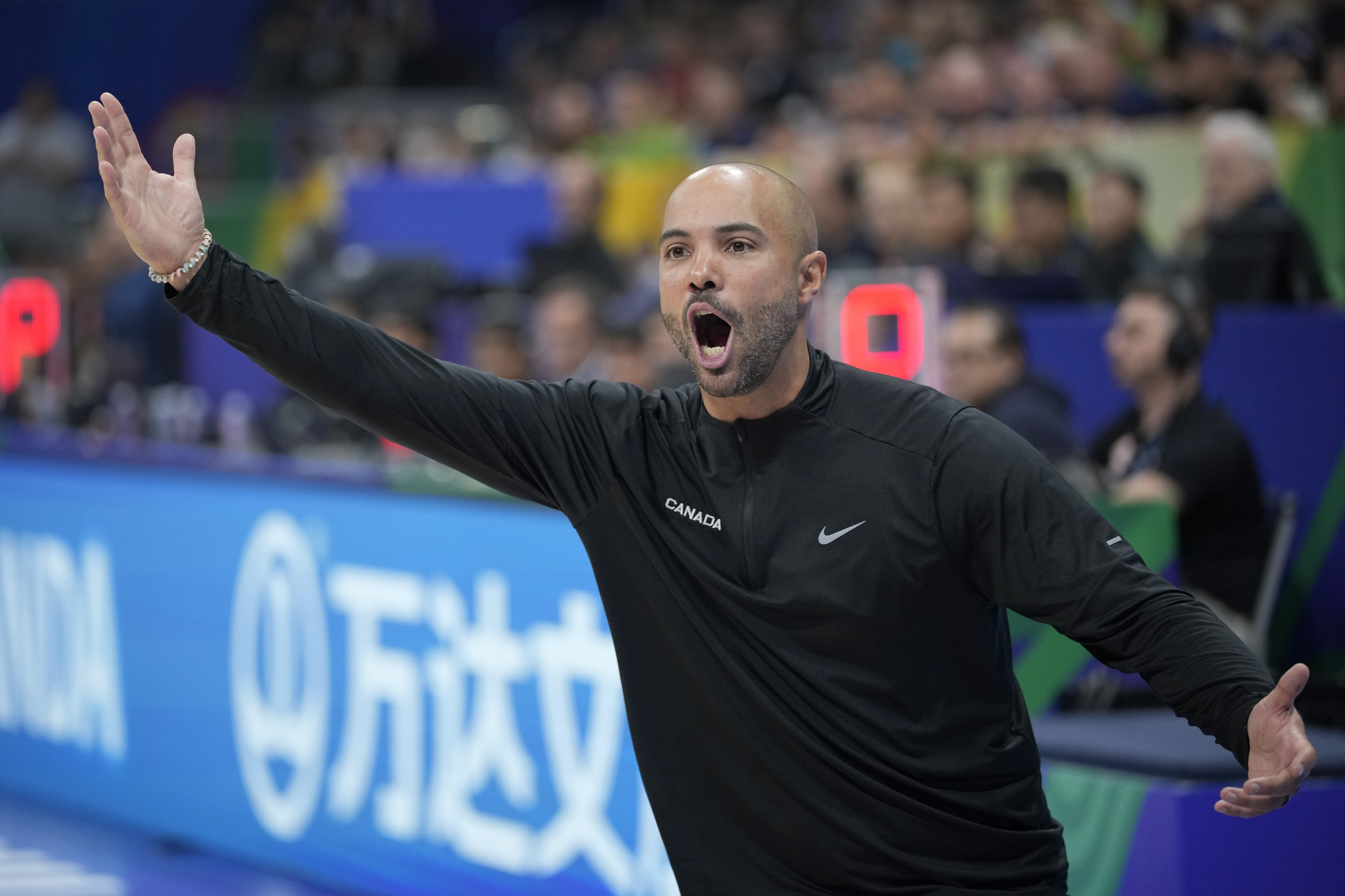 Canada head coach Jordi Fernandez Torres yells from the sidelines during the first half of a Basketball World Cup quarterfinal game against Slovenia in Manila, Philippines, Wednesday, Sept. 6, 2023. (AP Photo/Aaron Favila)