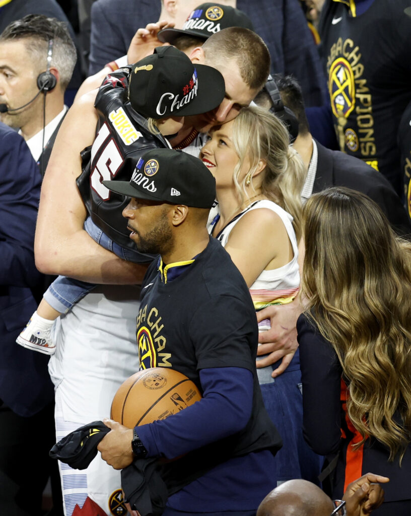 epa10687804 Denver Nuggets center Nikola Jokic of Serbia hugs his wife as he holds his child after defeating the Miami Heat to win the NBA championships at Ball Arena in Denver, Colorado, USA, 12 June 2023.  EPA-EFE/JOHN G. MABANGLO  SHUTTERSTOCK OUT