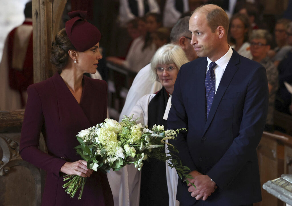 Britain's Prince William, and Kate, Princess of Wales, left, attend a service at St Davids Cathedral, for the first anniversary of Queen Elizabeth II's death, in St. Davids, Wales, Britain, Friday, Sept. 8, 2023. (Toby Melville/PA via AP)