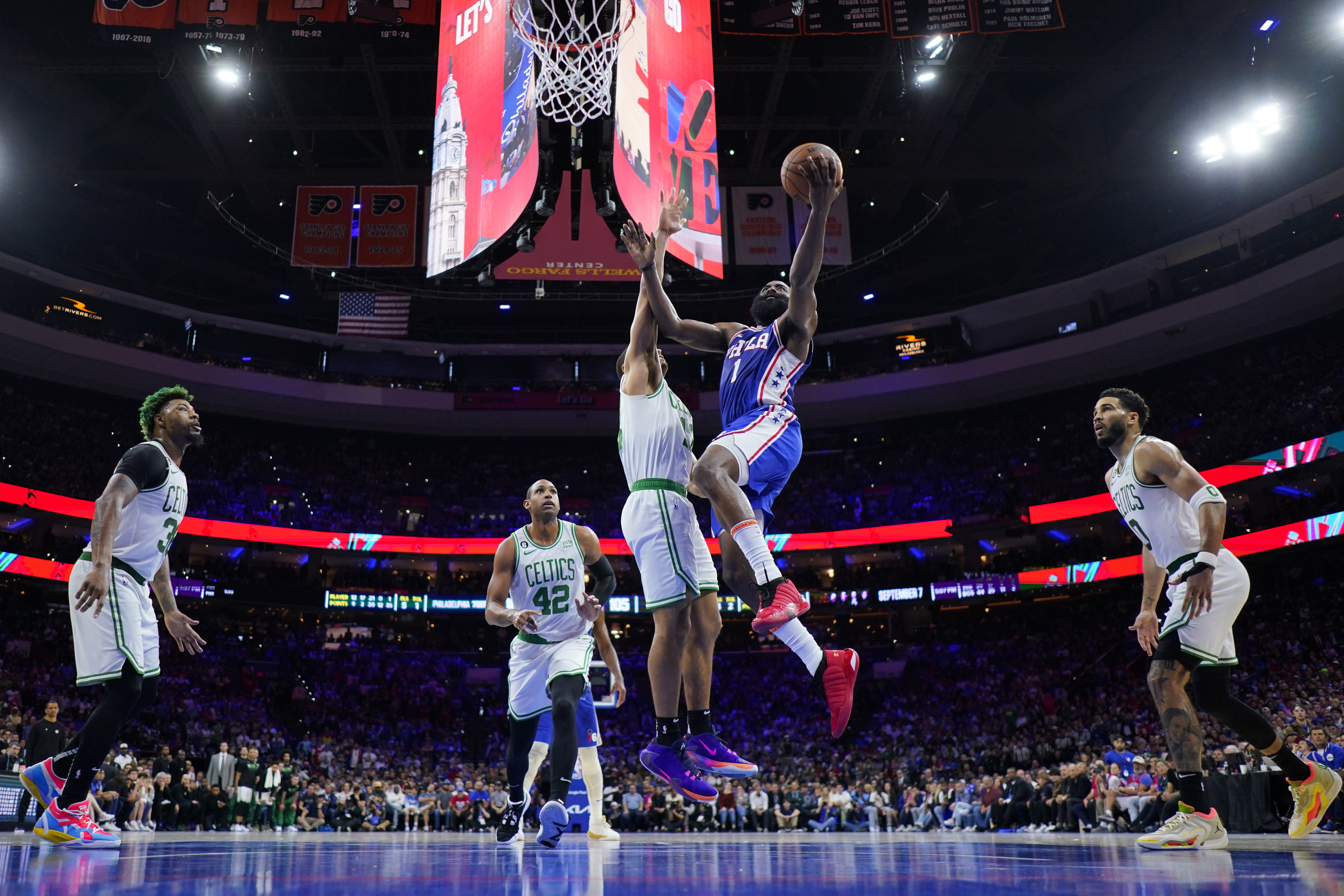 Philadelphia 76ers' James Harden (1) goes up to shoot against Boston Celtics' Malcolm Brogdon during the second half of Game 4 in an NBA basketball Eastern Conference semifinals playoff series, Sunday, May 7, 2023, in Philadelphia. (AP Photo/Matt Slocum)