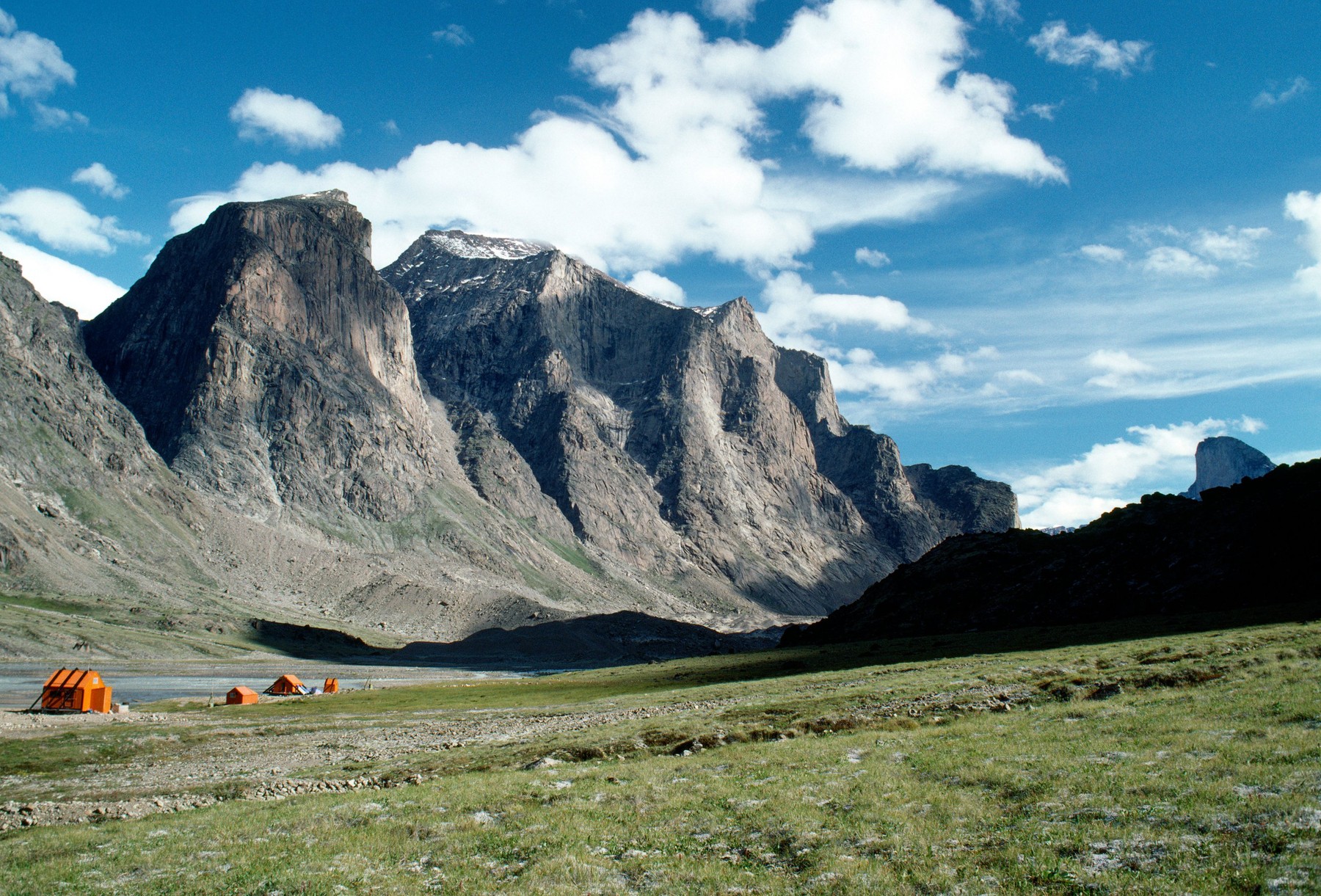 Bright orange emergency shelter huts, Auyuittuq National Park; Baffin Island; Nunavut; Canada