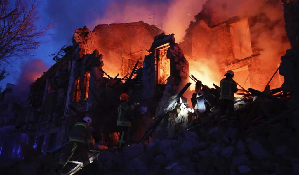In this image taken from video provided by the Ukrainian Emergency Service, emergency services work at a scene of destroyed residential area after a Russian attack in Mykolaiv, Ukraine, Thursday, July 20, 2023. (Ukrainian Emergency Service via AP)