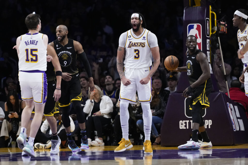 Los Angeles Lakers' Anthony Davis (3) reacts after making a basket during the second half of an NBA basketball game against the Golden State Warriors, Sunday, March 5, 2023, in Los Angeles. (AP Photo/Jae C. Hong)