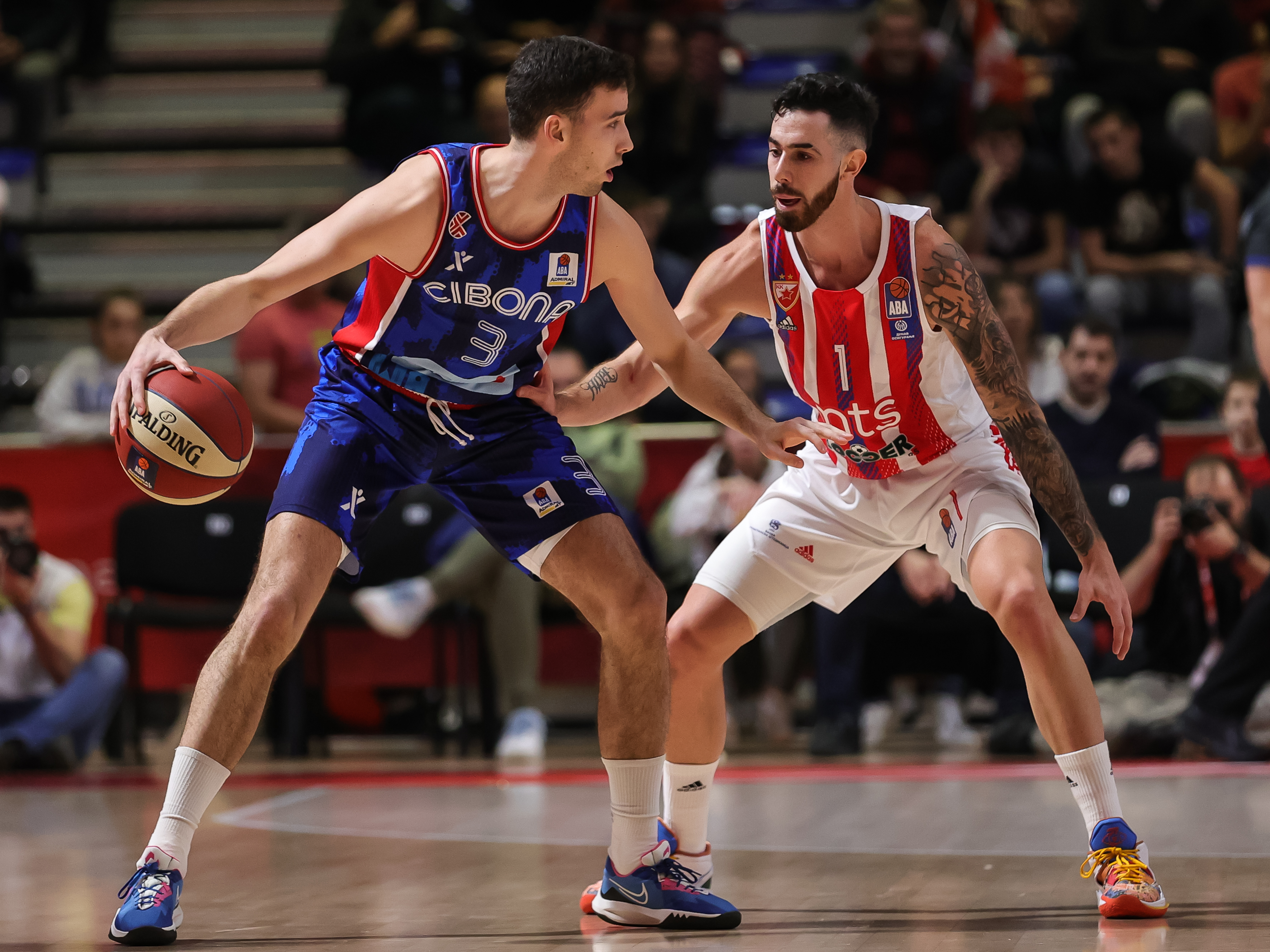 Kresimir Radovcic (L) and Luca Vildoza during the 2022/2023 Aba League match between Crvena Zvezda mts Belgrade and Cibona Zagreb at Aleksandar Nikolic Hall on November 19, 2022 in Belgrade, Serbia. (Photo by Srdjan Stevanovic/Starsport.rs ©)