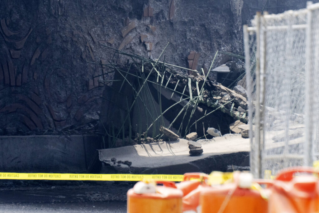 Officials work on the scene following a collapse on I-95 after a truck fire, Sunday, June 11, 2023 in Philadelphia. (AP Photo/Joe Lamberti)