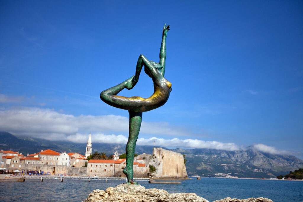 BUDVA, MONTENEGRO - CIRCA June 2012 - The Dancing Girl Statue outside of the Old Town (Stari Grad) of the coastal town of Budva. The statue is a popular photographic spot on the path to Mogren Beach.